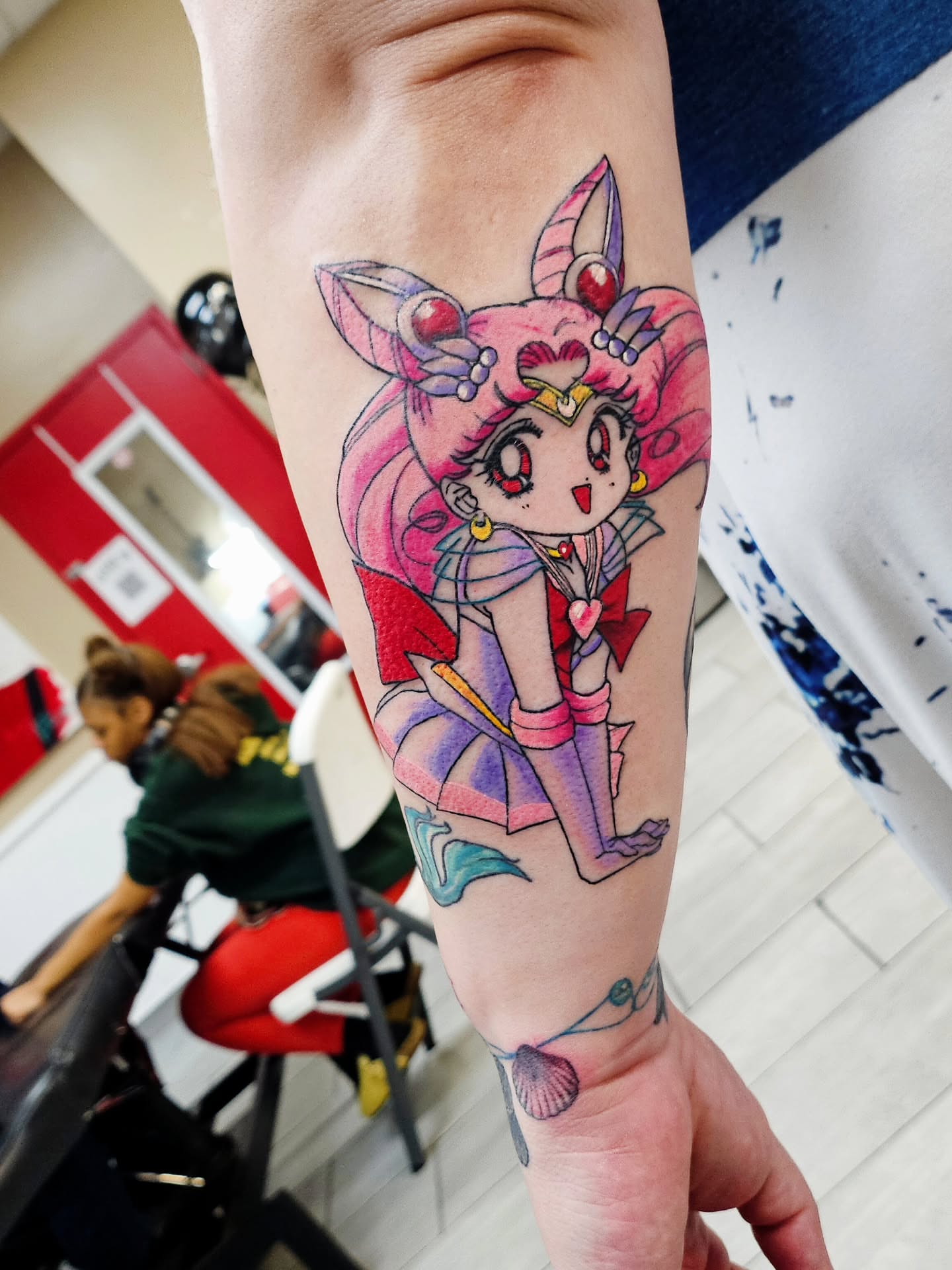 Anime character watercolor tattoo on the forearm by Kelsey Moore, Richmond, Virginia