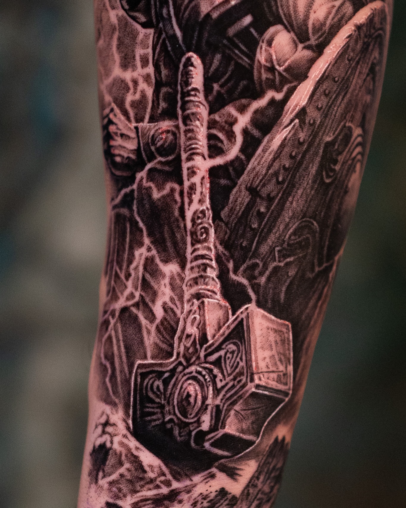 Thor's hammer realism tattoo on the forearm by Mark Vata