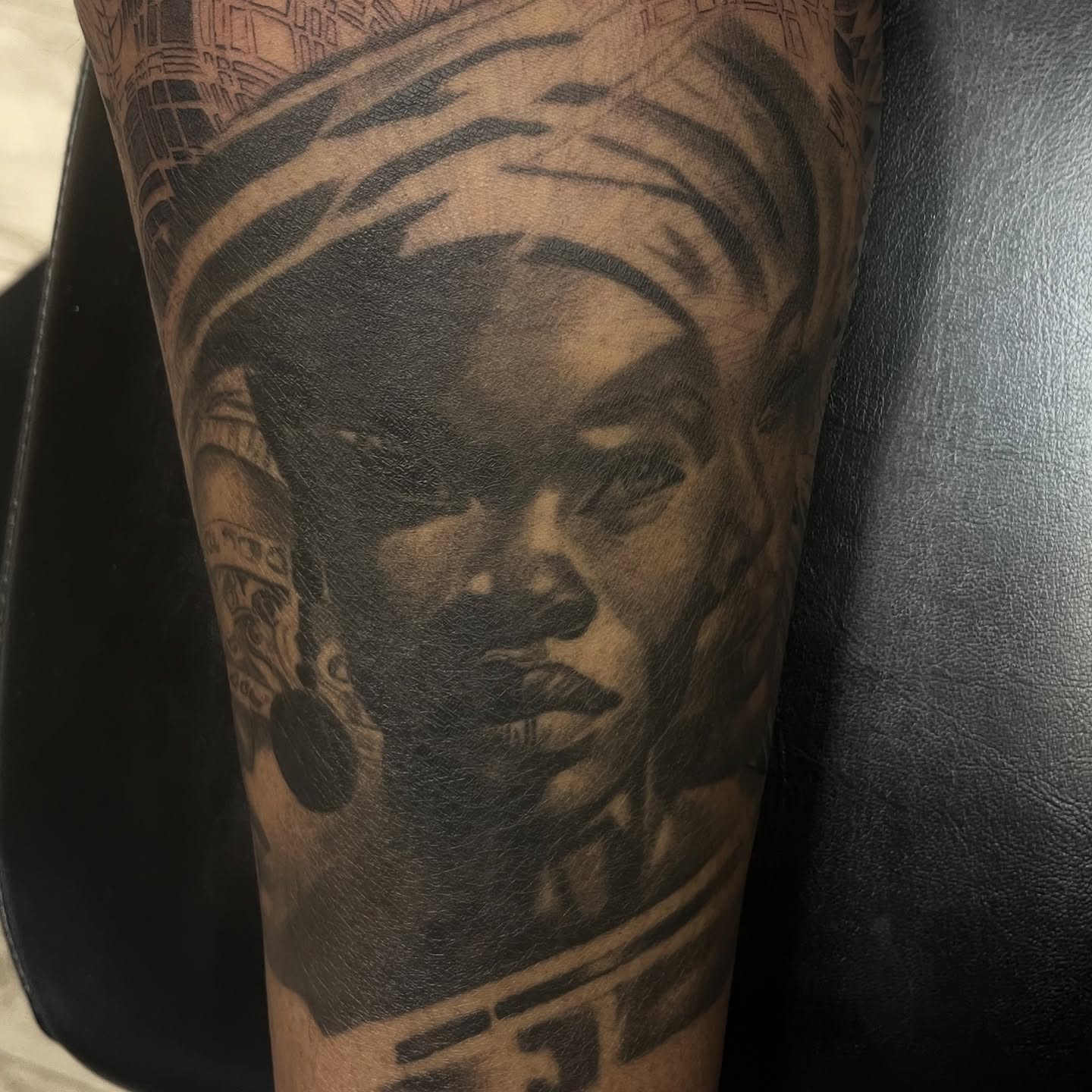 Portrait realism tattoo on the forearm by Quinten Harper