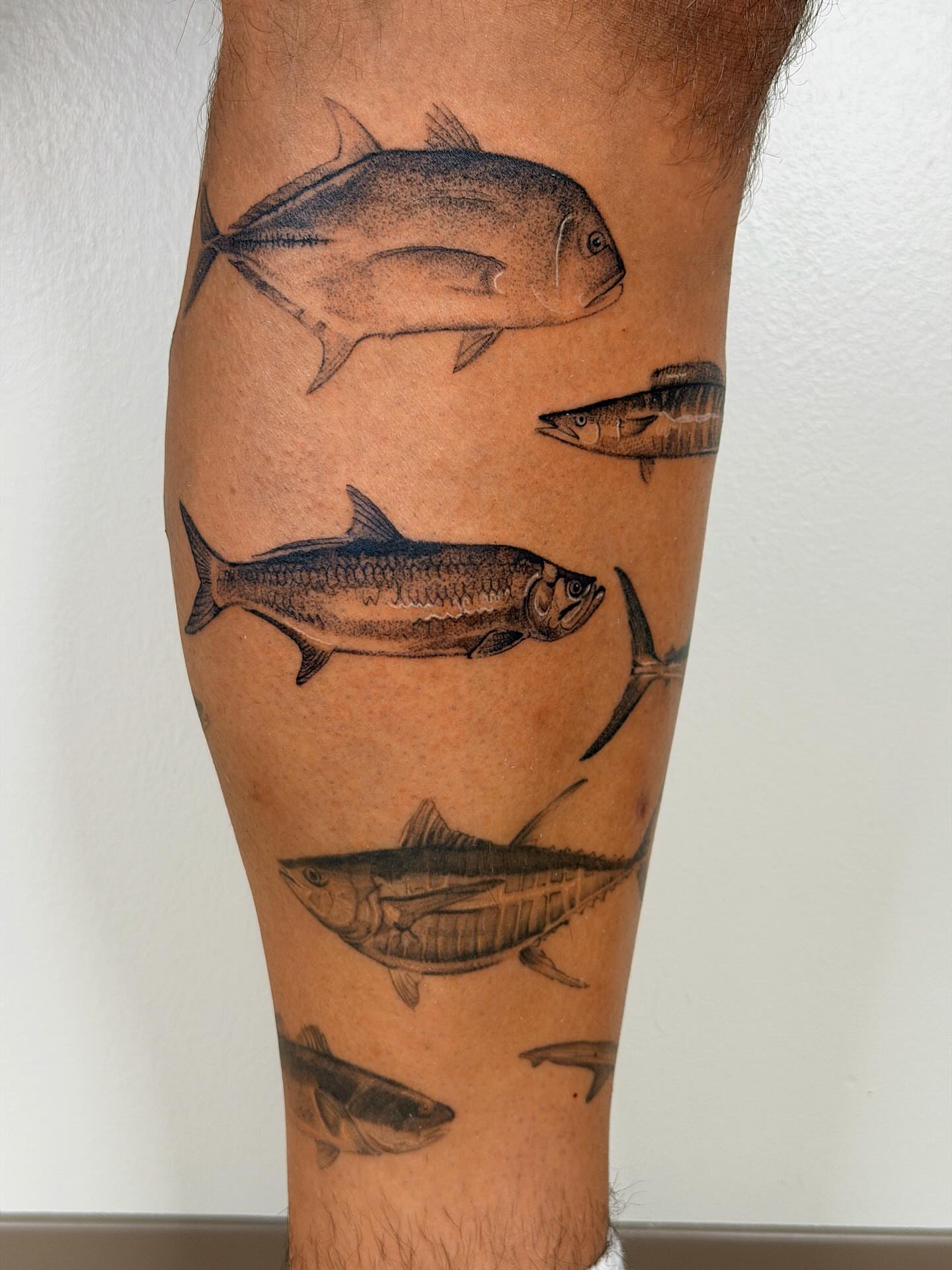 Fish realism tattoo on the forearm by Nate Weaver
