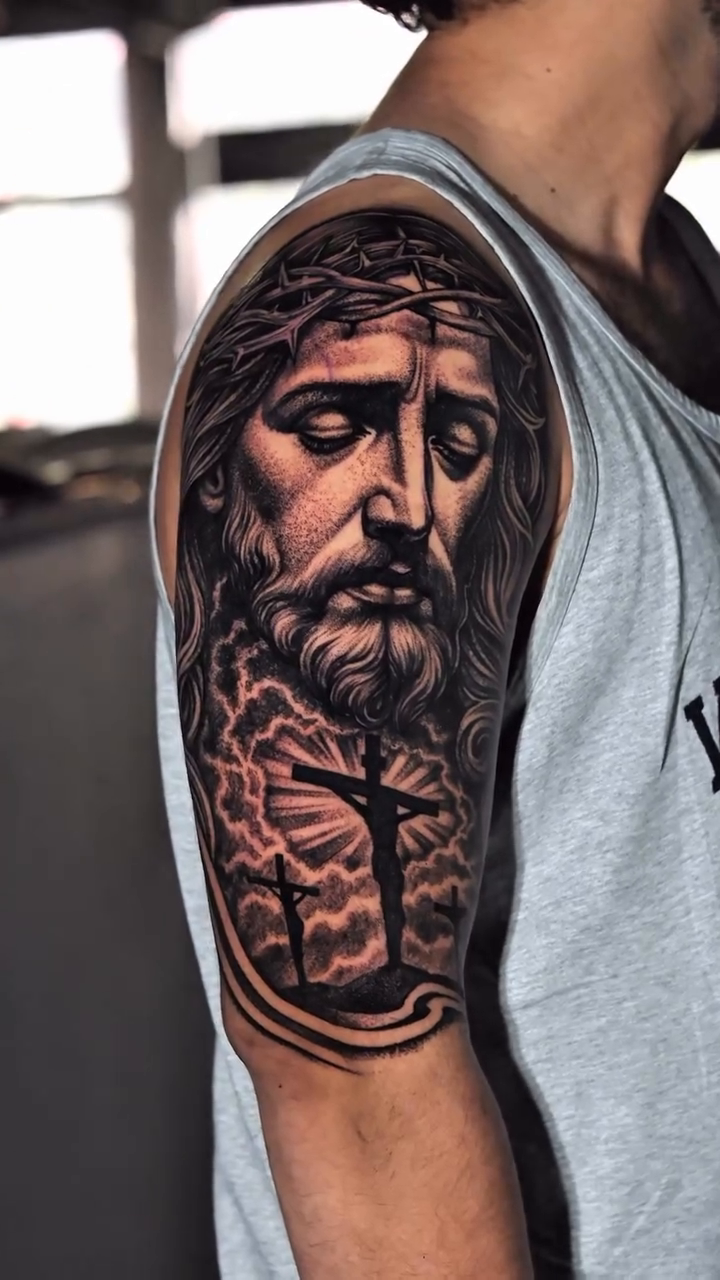 Jesus Christ on the cross realism tattoo by Jack Alvarado.