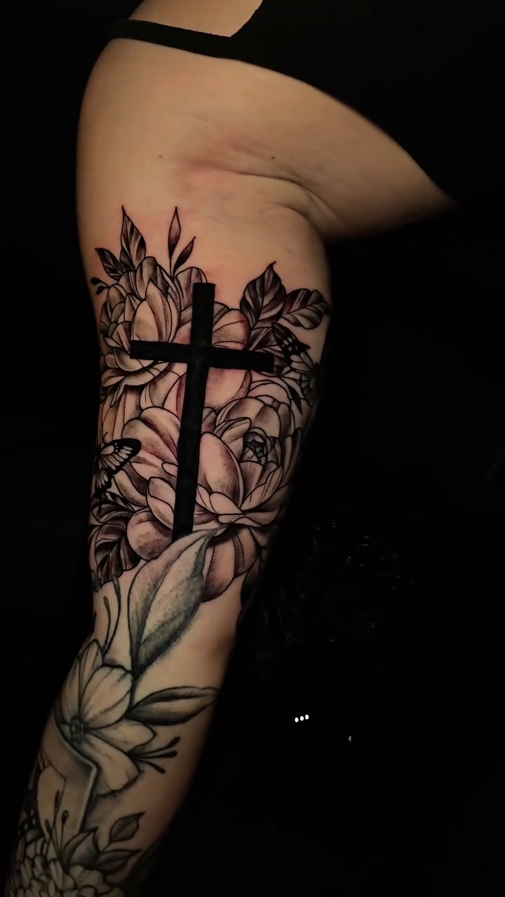 Cross with flowers realism tattoo by Camuel Whaley