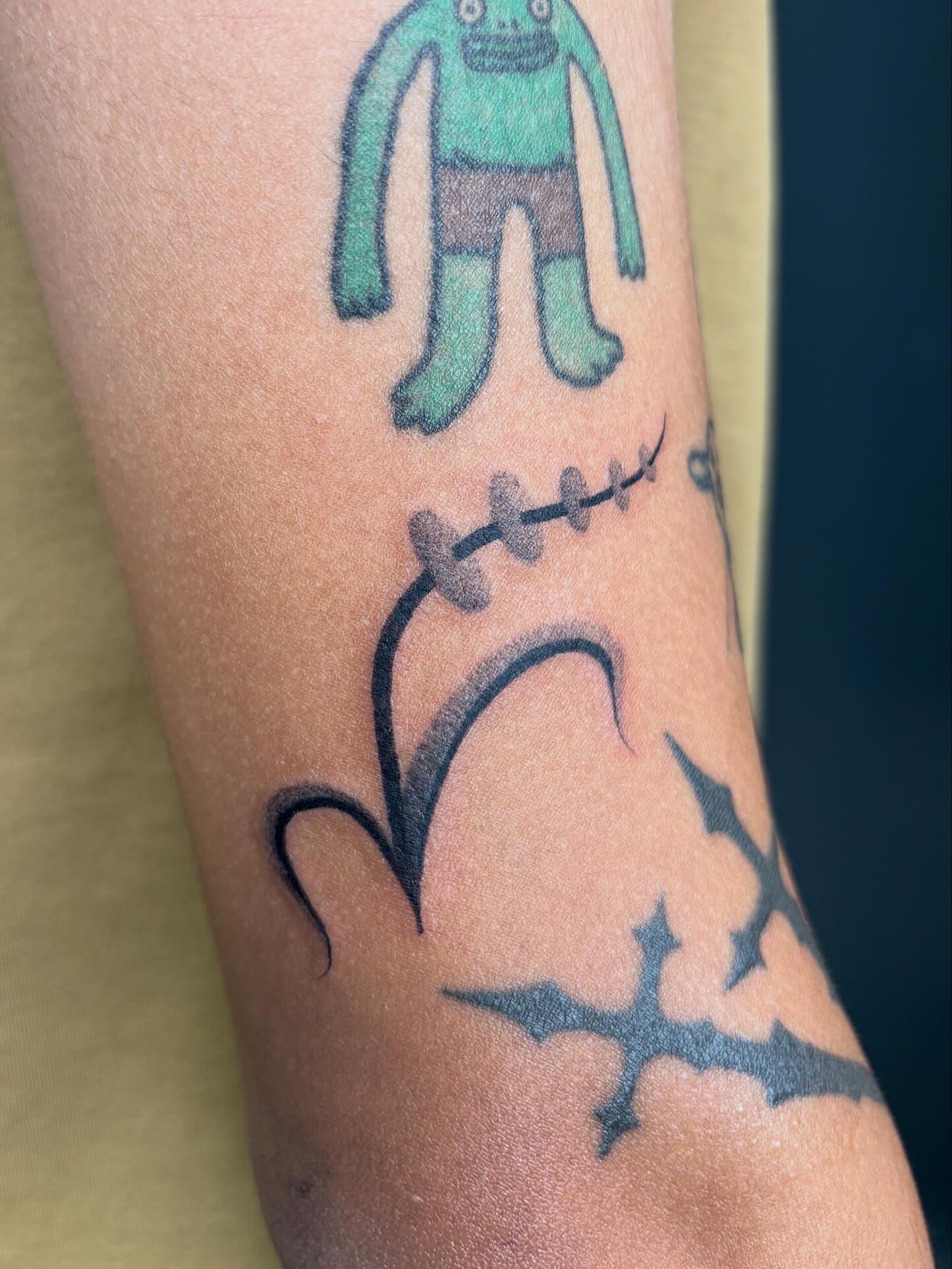 Alien and skull dotwork tattoo on the forearm by ꜱʜɪʀʟᴇʏ