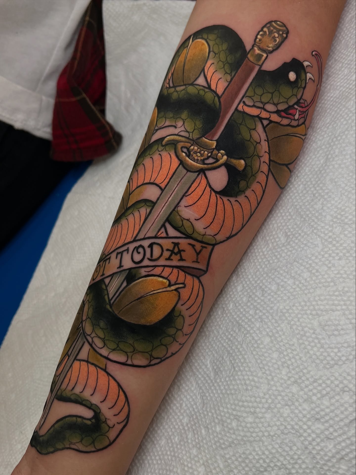 Snake and dagger American traditional tattoo on the forearm by Neotrav Tattoos