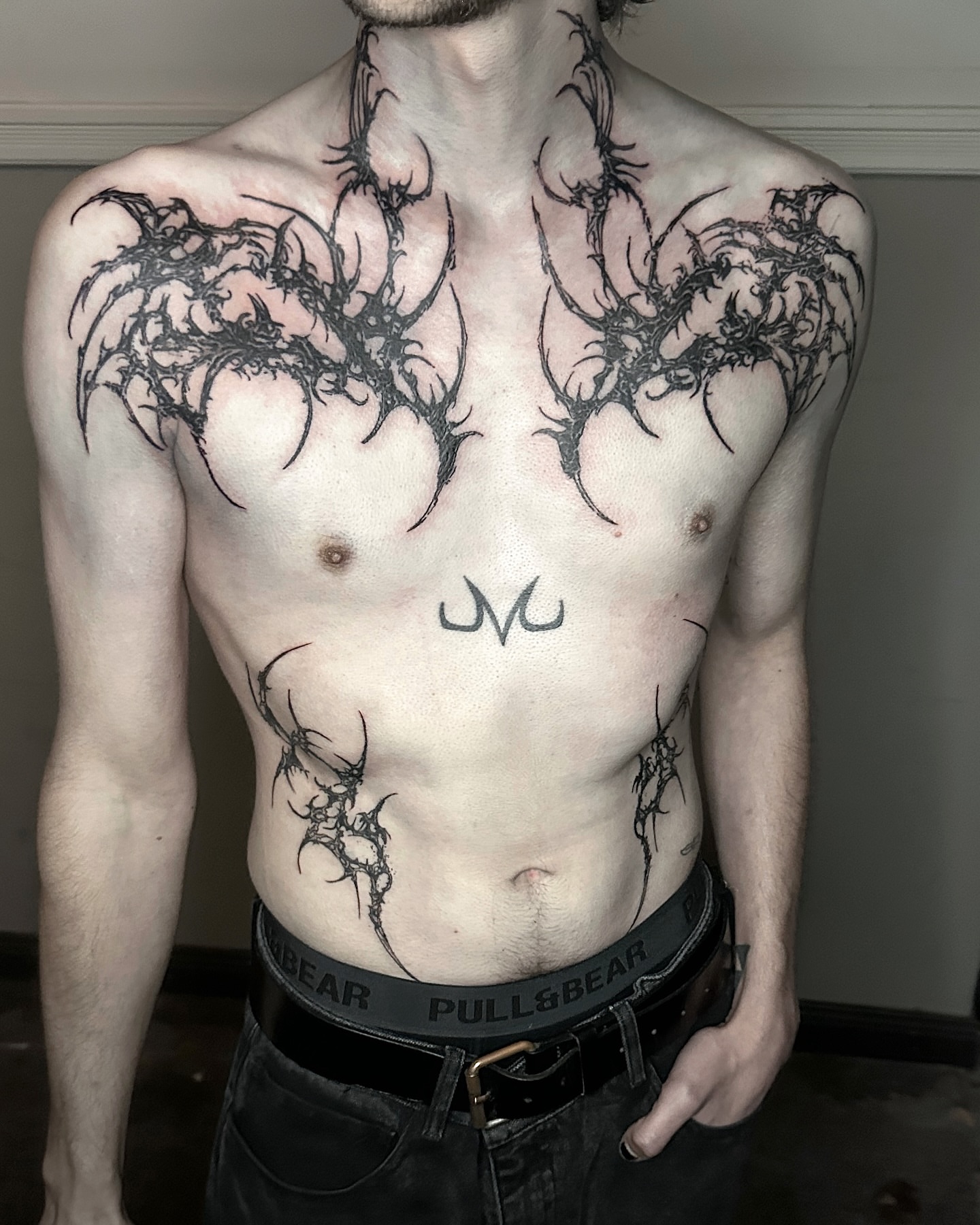 Spiderweb black and grey tattoo on the chest by Gun