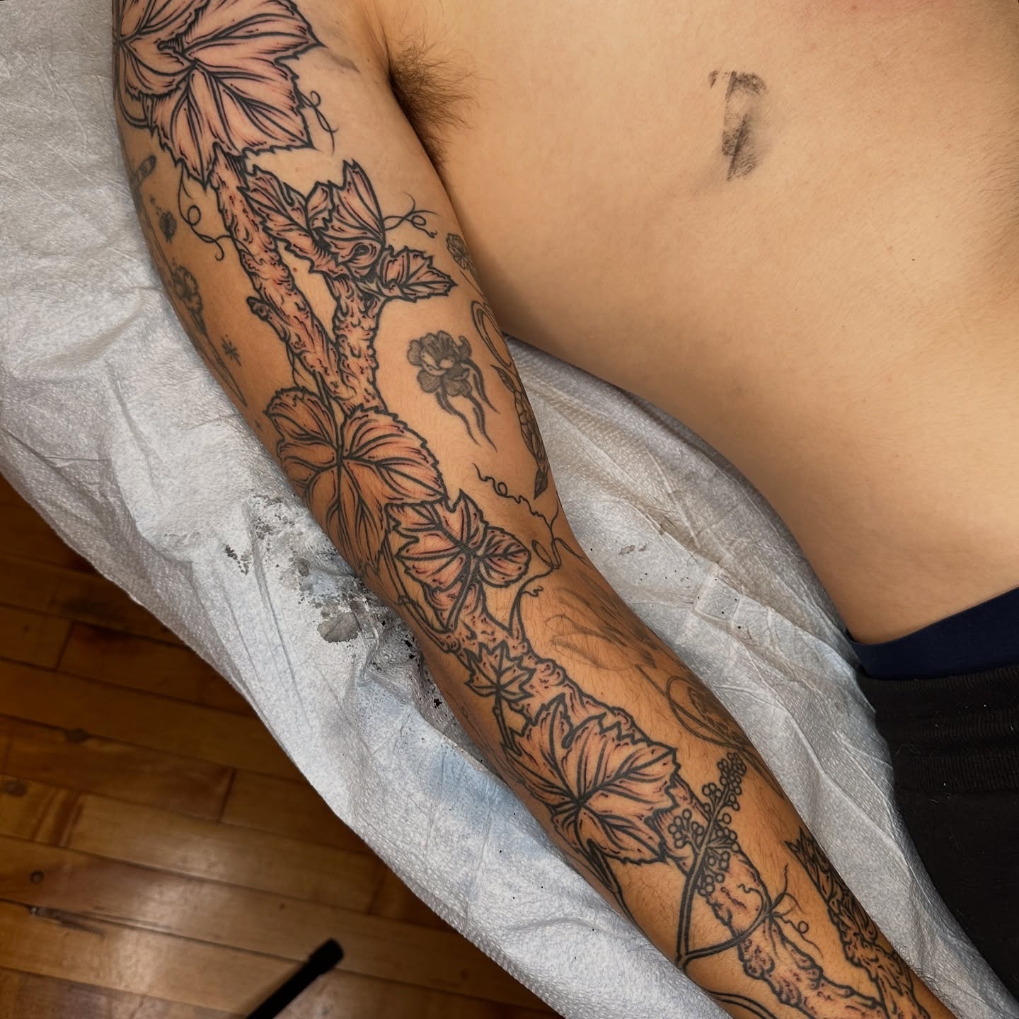 Floral vine black and grey tattoo on the forearm by rosalie