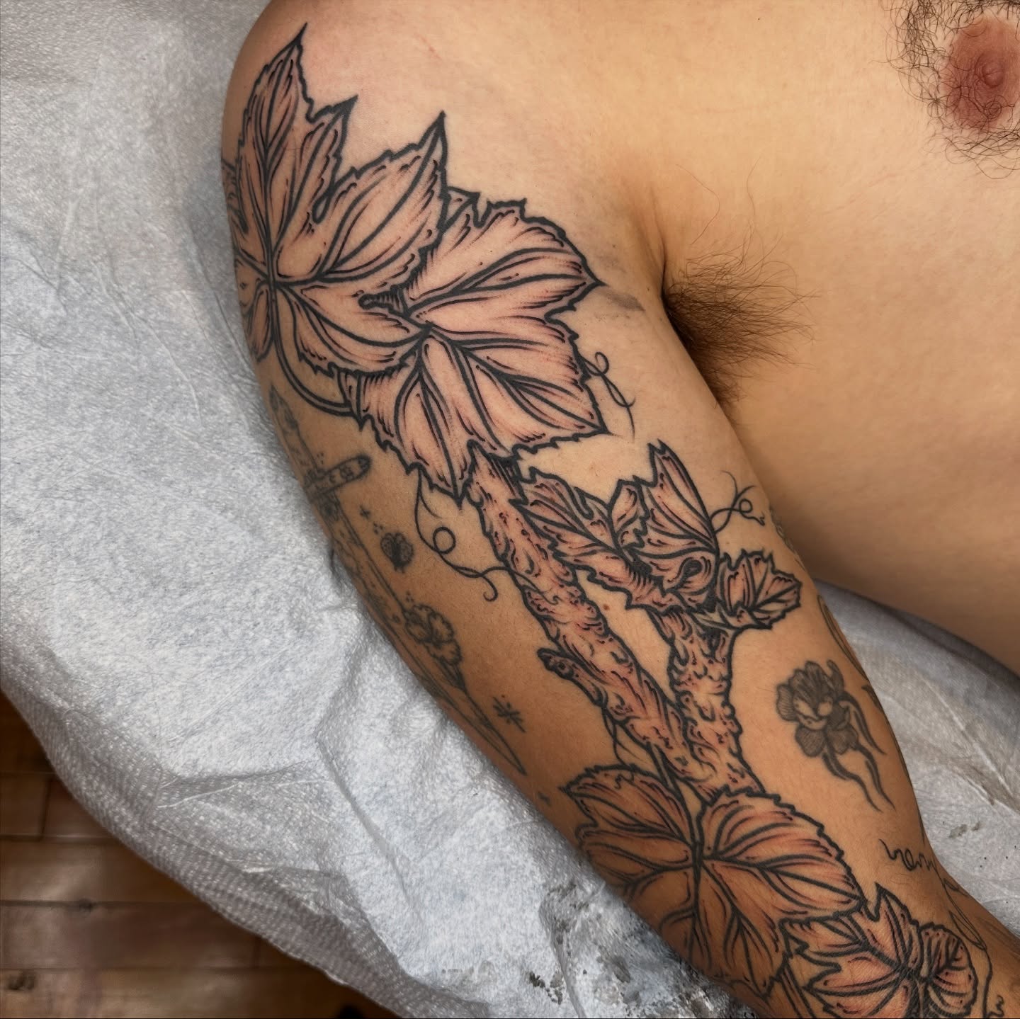 Hop plant black and grey tattoo on the forearm by rosalie