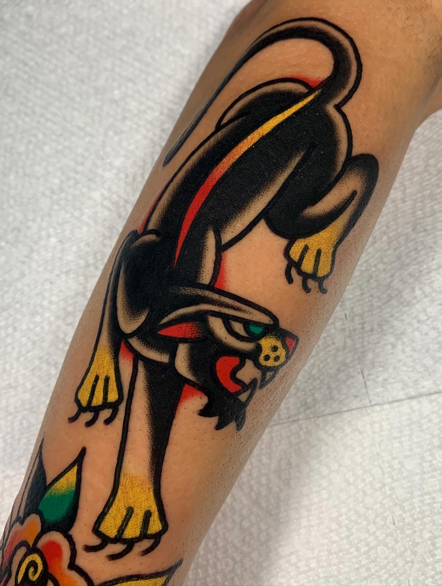Panther American traditional tattoo on the forearm by Shawn VanKirk