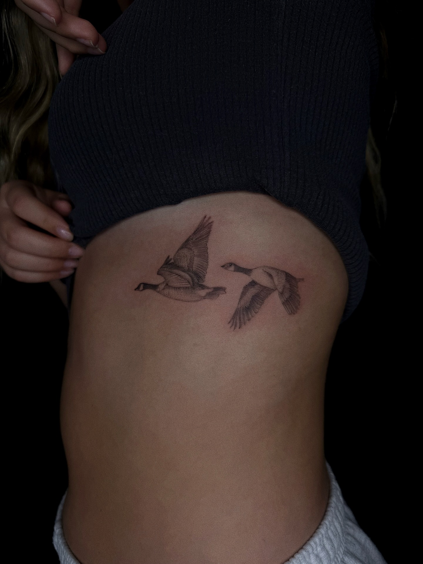 Geese black and grey tattoo on the ribs by elena