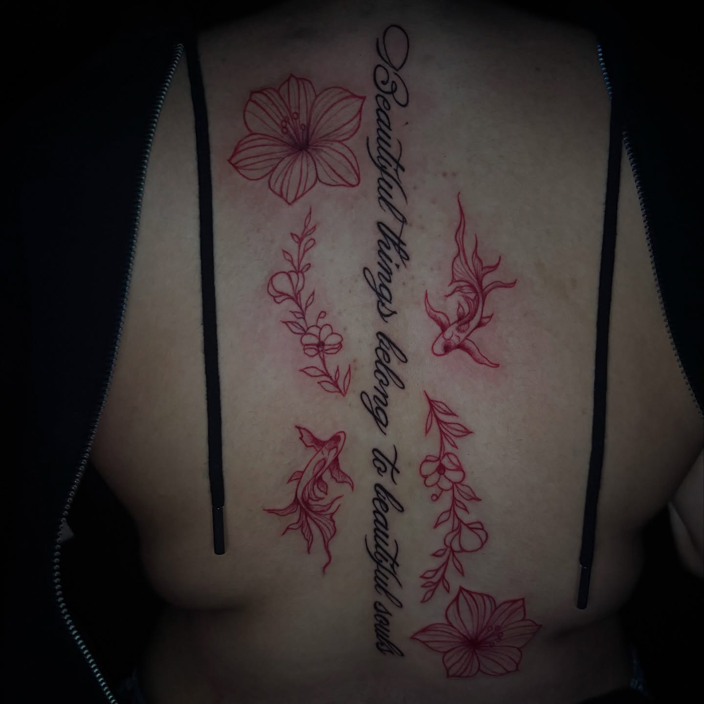 Flowers and fish fine line tattoo on the ribs by La Doña’s Tinta 🖋️, Lynn, Massachusetts