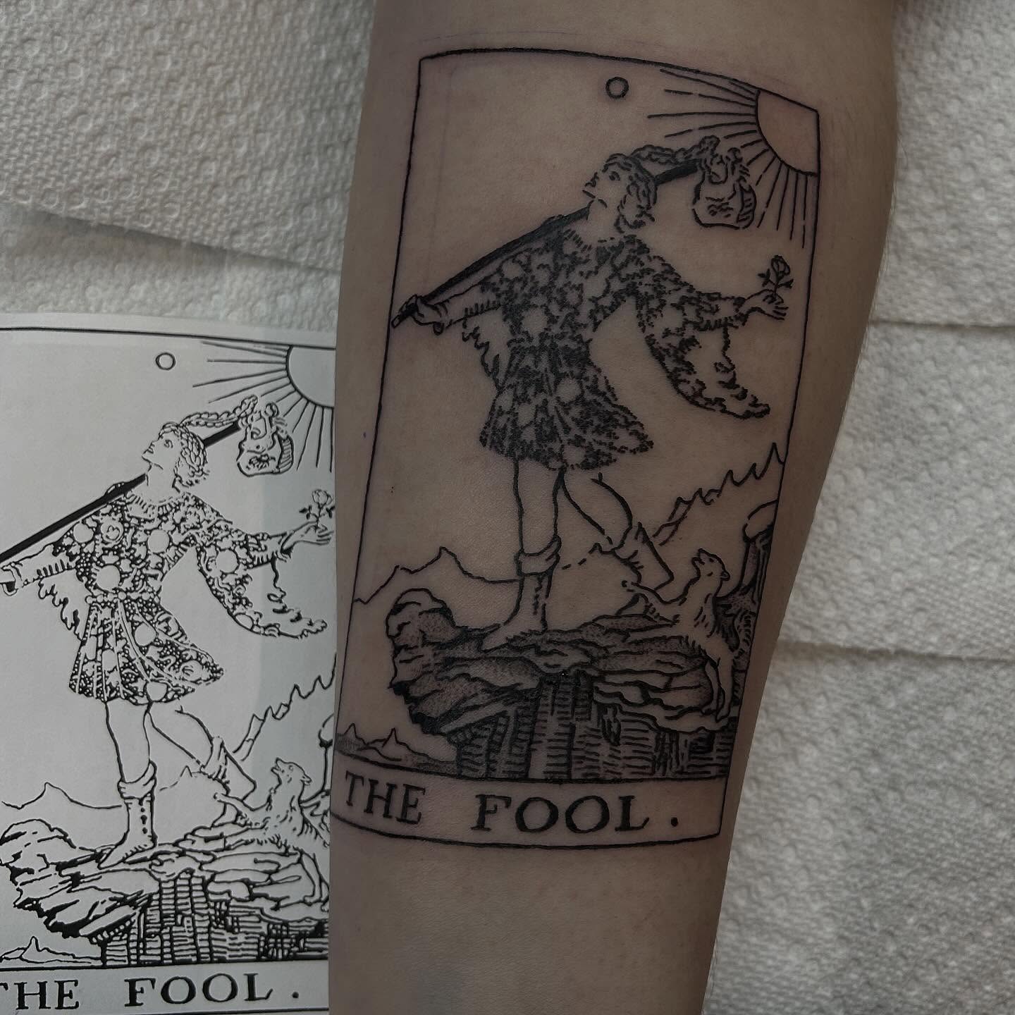 The fool tarot card black and grey tattoo on the forearm by abby ☽ marie