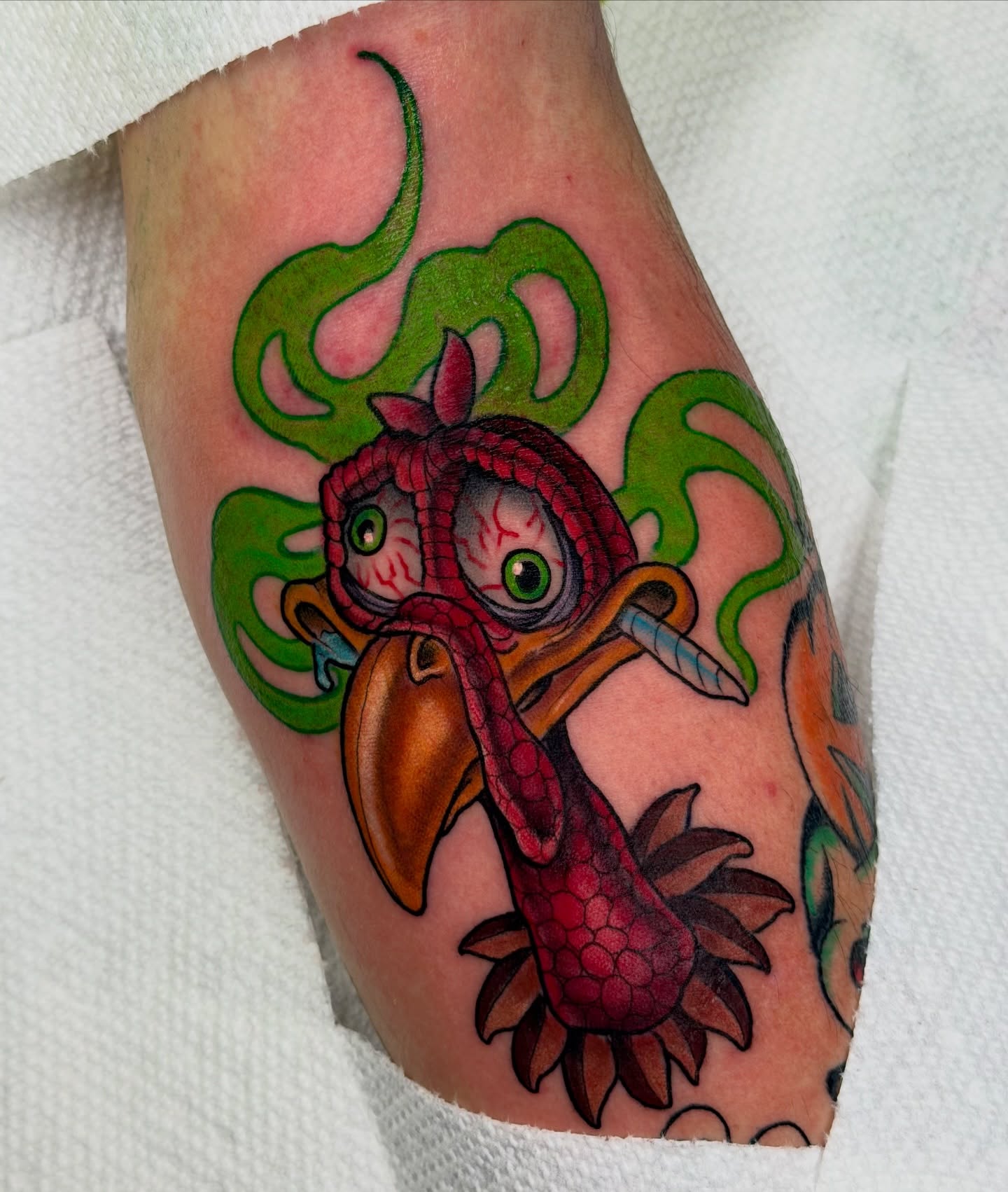 Koi fish American traditional tattoo on the forearm by Kyle Kuhn