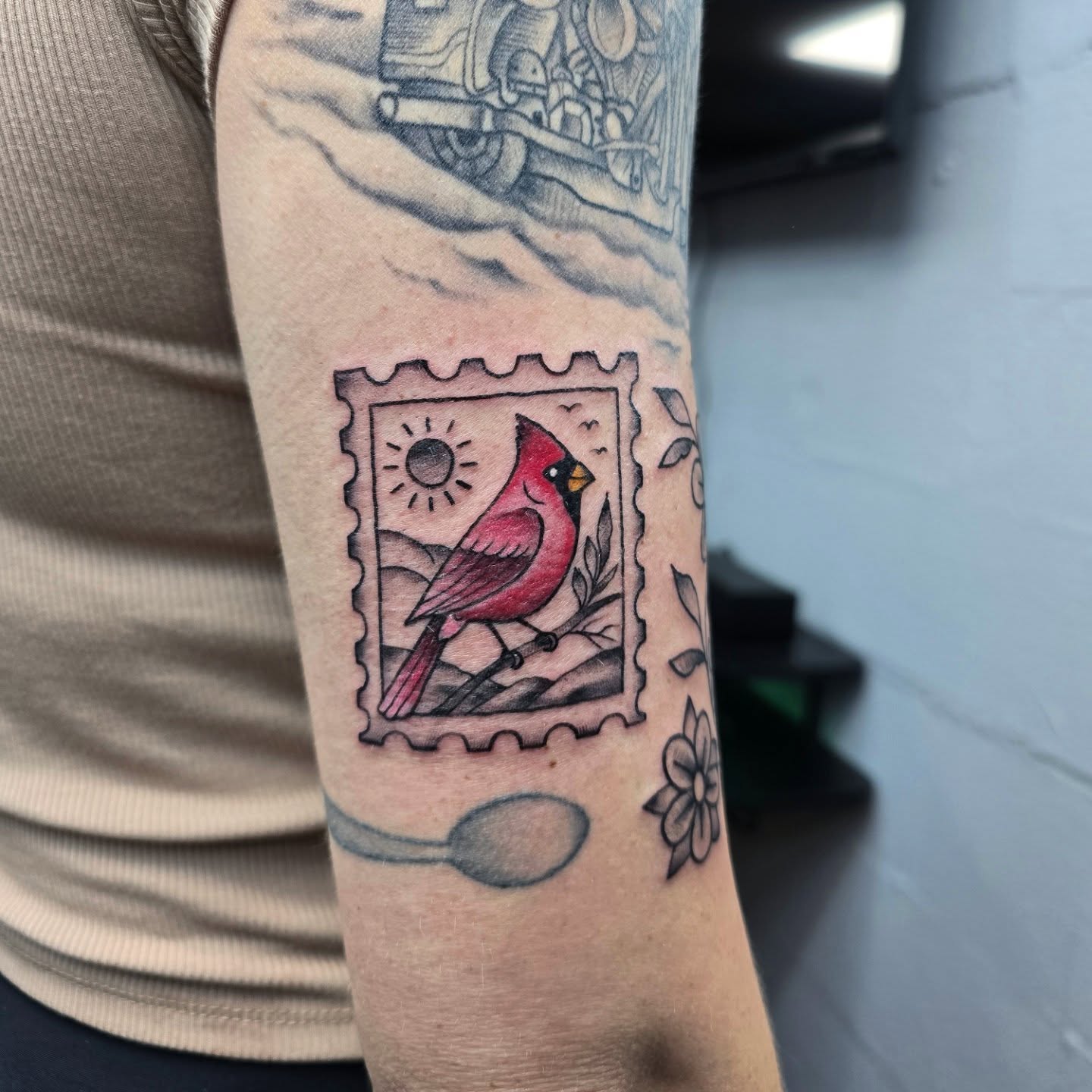 Cardinal bird American traditional tattoo on the forearm by Jon Griffin, Maryville, Tennessee