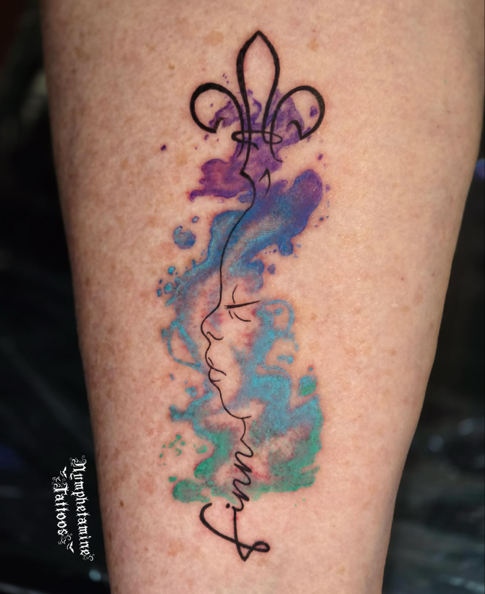 Fleur-de-lis and name watercolor tattoo on the forearm by ๐ธ๐๐๐๐๐๐๐๐