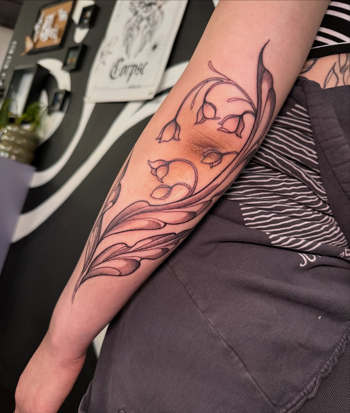 Bell flowers black and grey tattoo on the forearm by Velvet, Seattle, Washington