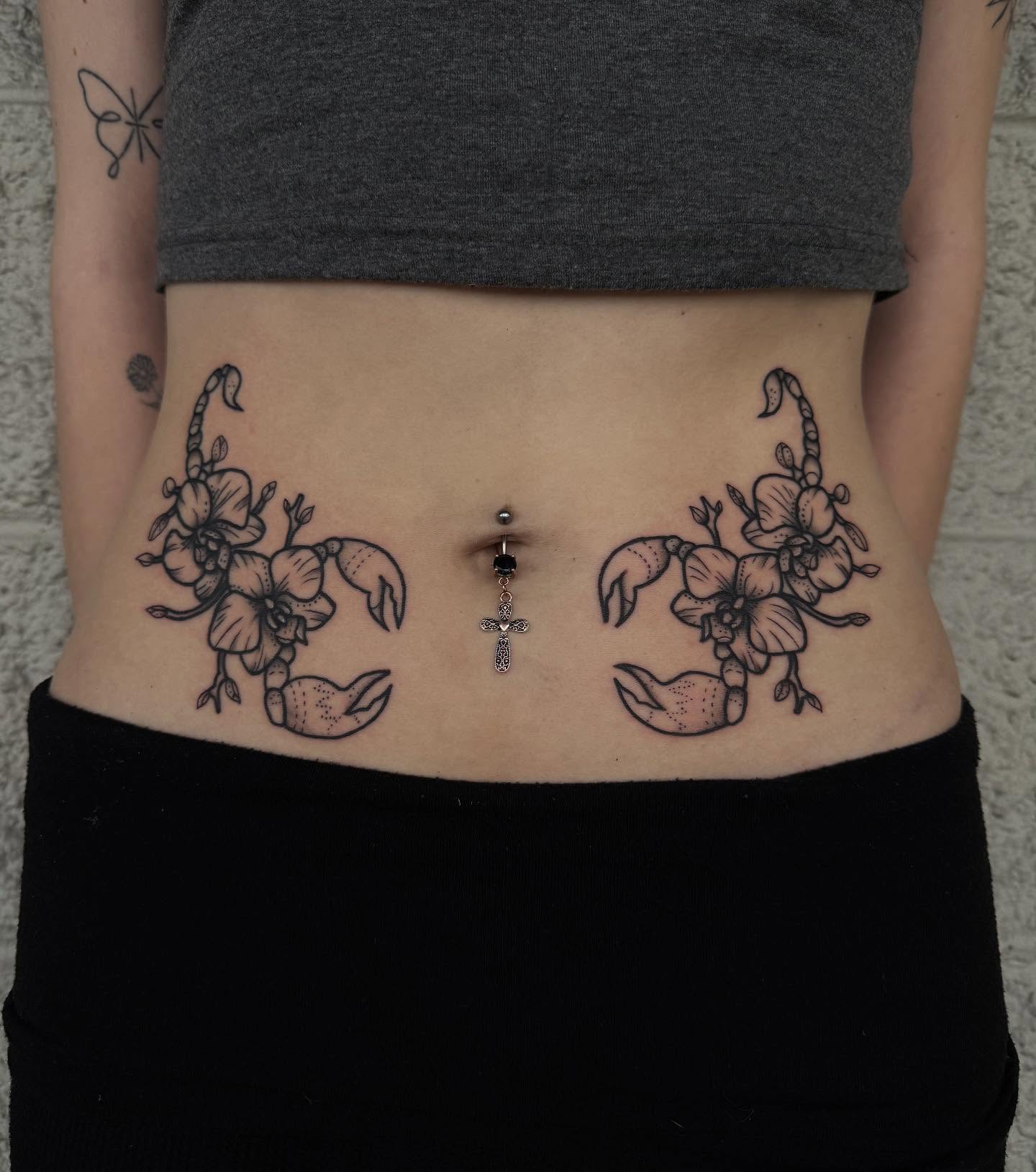 Scorpion and orchid black and grey tattoo on the torso by Kylee langford 🧿