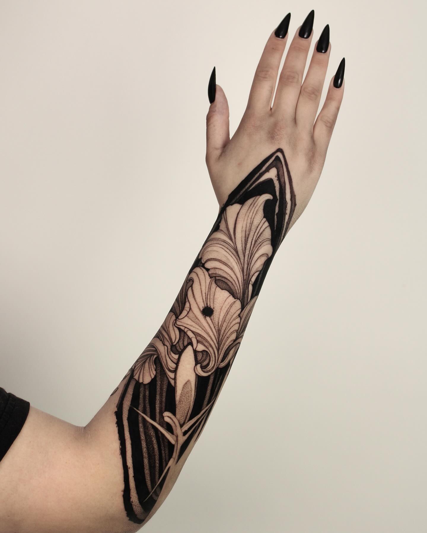 Floral design black and grey tattoo on the forearm by Heather Apgar