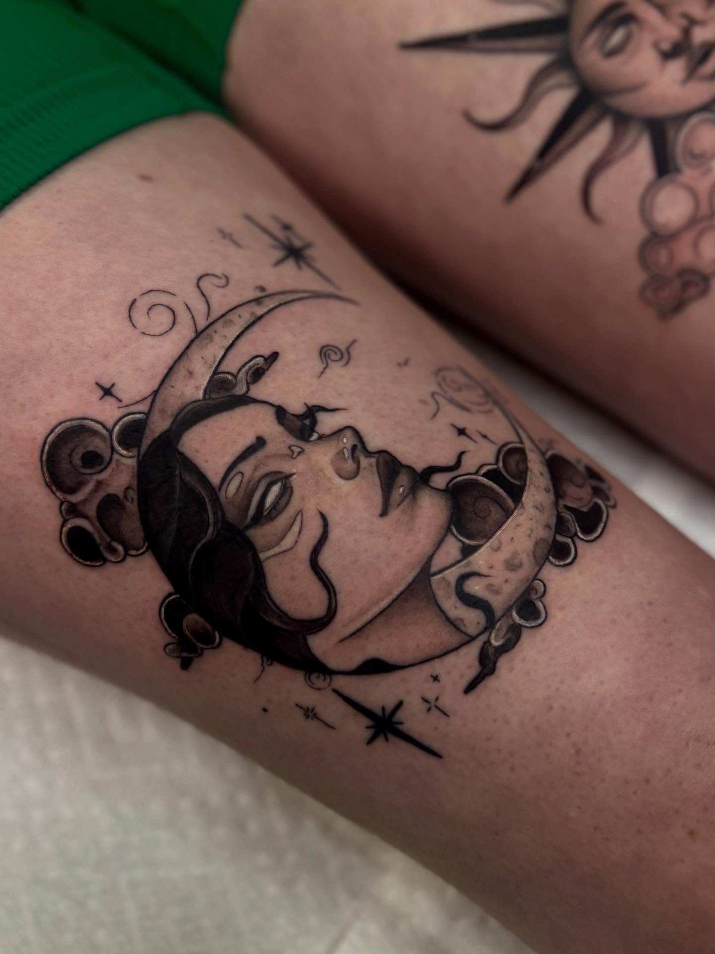 Woman with crescent moon black and grey tattoo on the forearm by Isabel Smith🦋🕷️