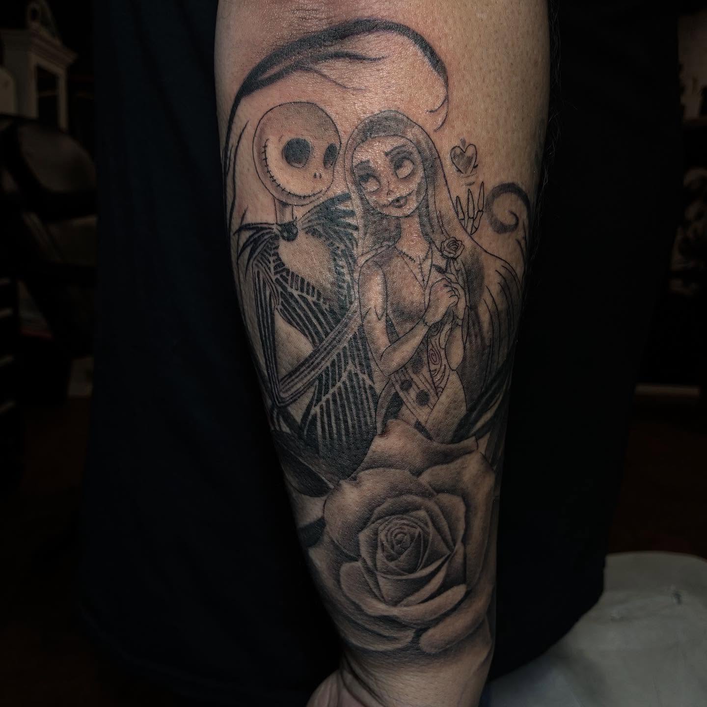 Jack and Sally dark realism tattoo on the forearm by Kat π