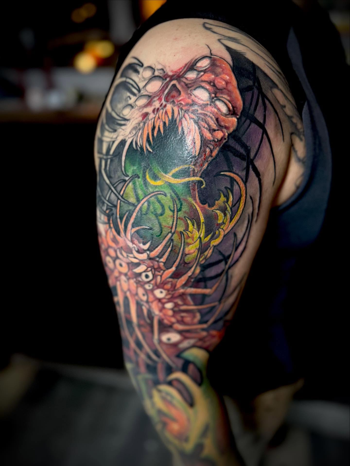 Zombie skull dark realism tattoo on the upper arm by jonhighland