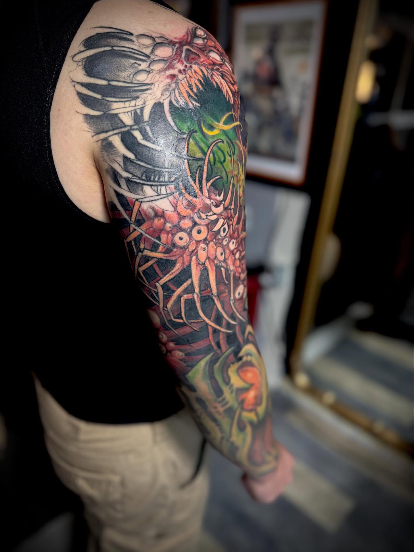 Insect dotwork tattoo on the upper arm by jonhighland