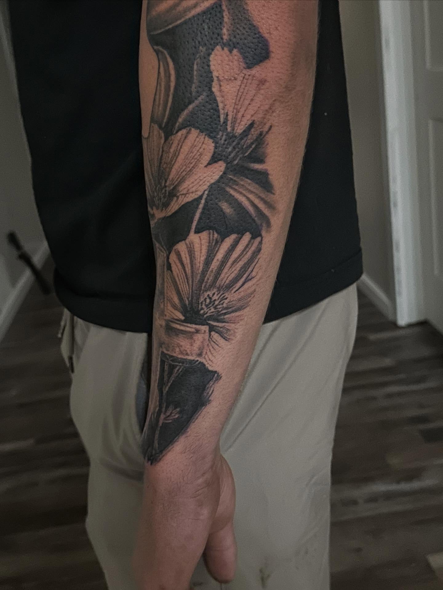 Flowers black and grey tattoo on the forearm by Neil5one3