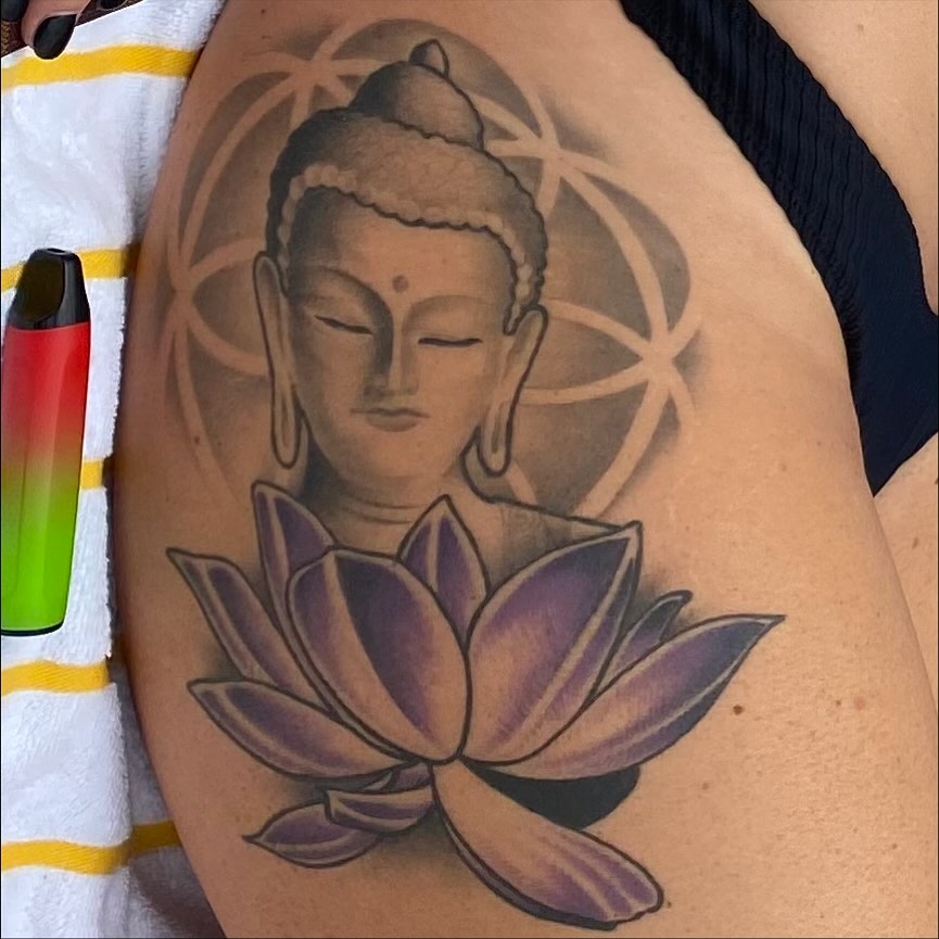 Lotus flower and Buddha realism tattoo on the thigh by Lee Brewster, Erlanger, Kentucky