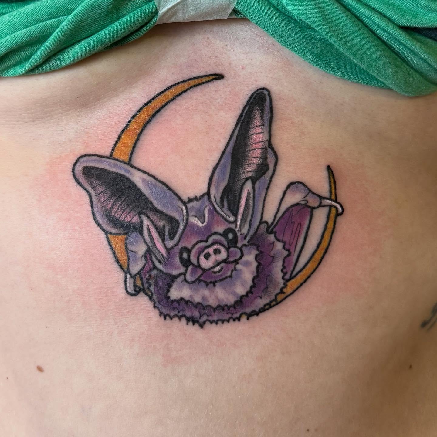 Bat American traditional tattoo on the chest by Erin McDavis