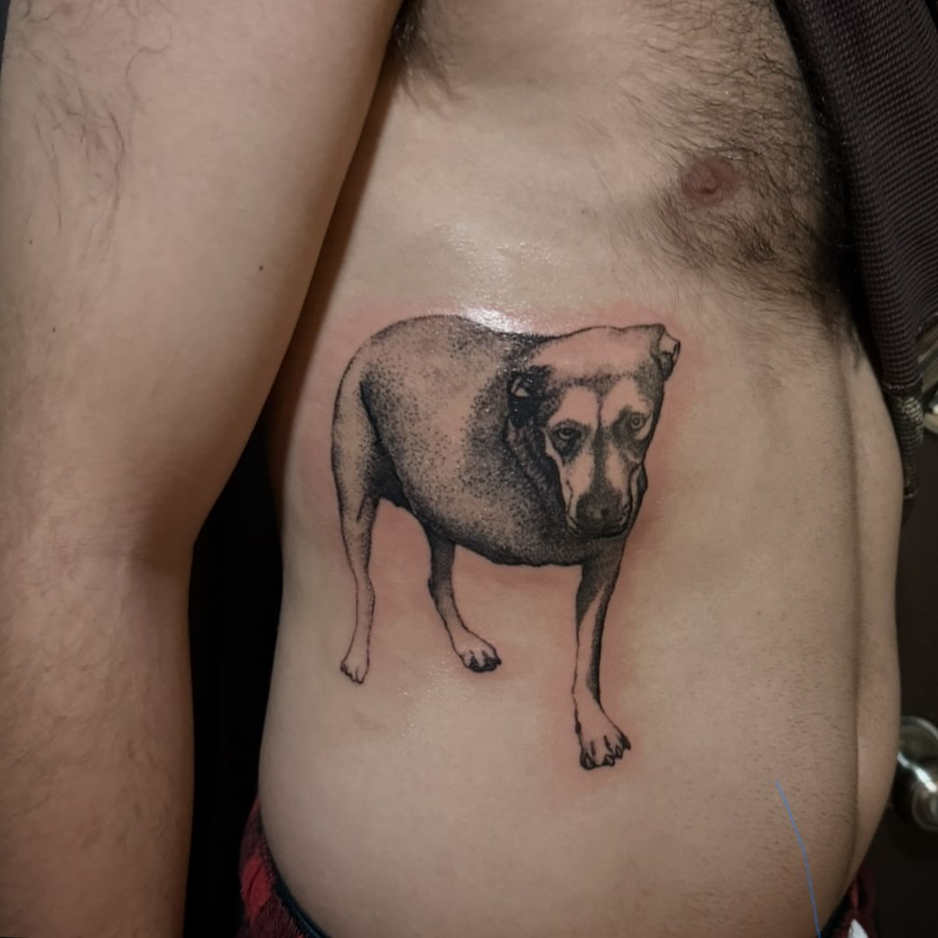 Dog dotwork tattoo on the chest by Brennan Walker, Orem, Utah