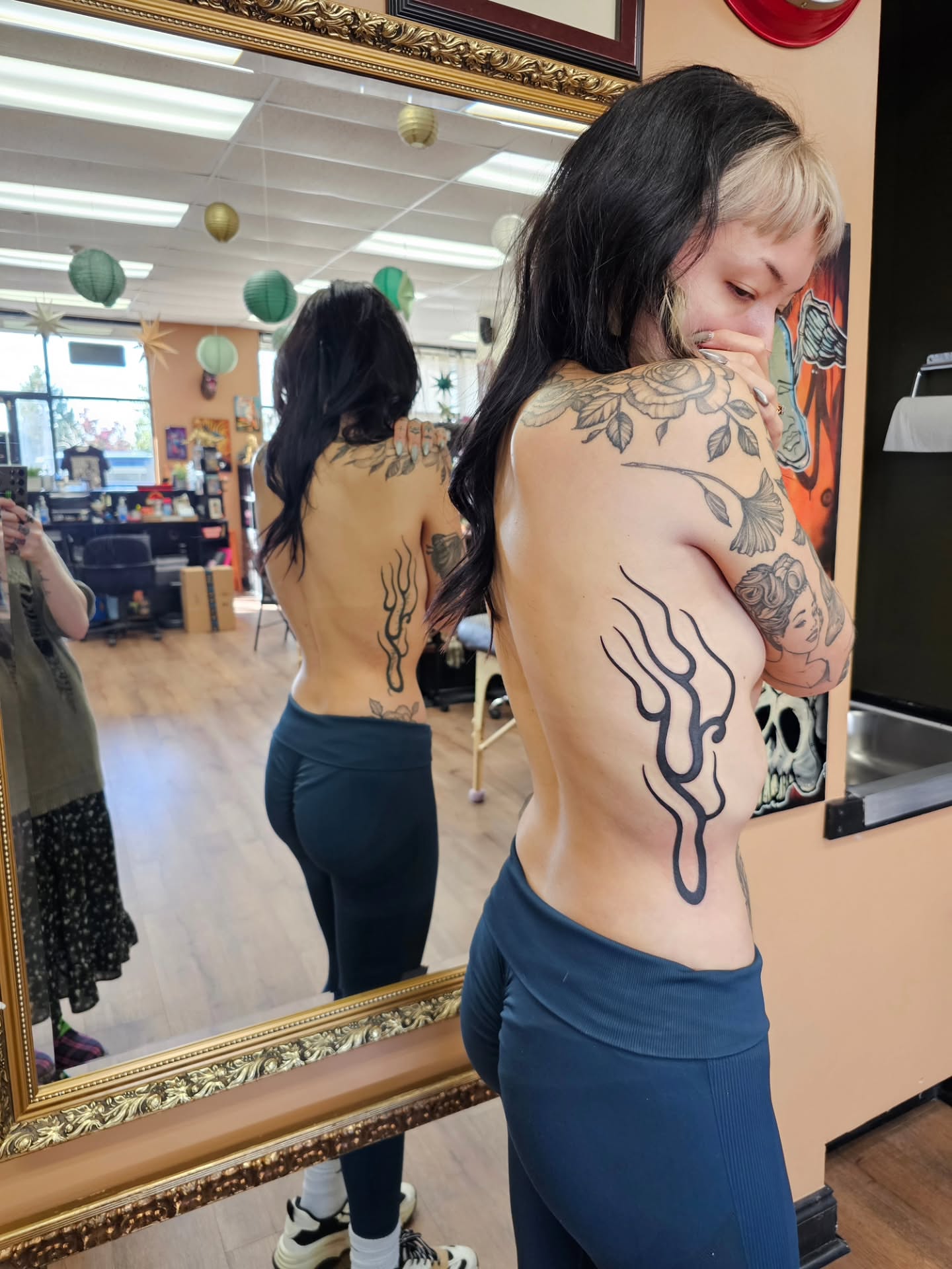 Flame tribal tattoo on the back by Bellz Rehder