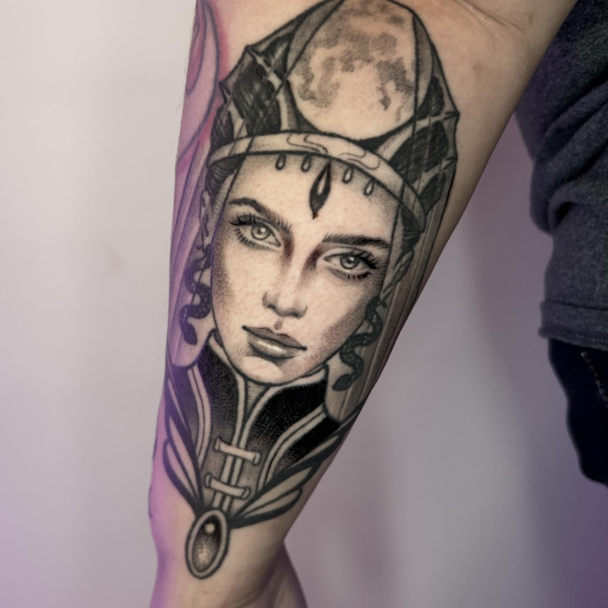 Woman's face realism tattoo on the forearm by Whitney Harbin