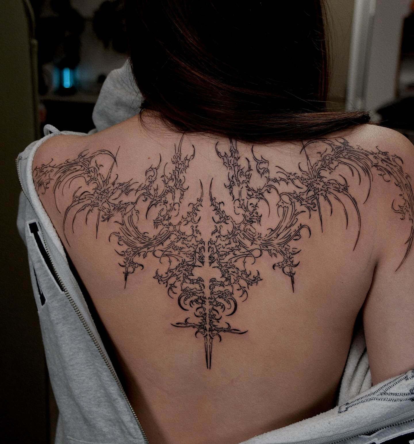 Floral wings ornamental tattoo on the back by Gary Zhong, Upland, California