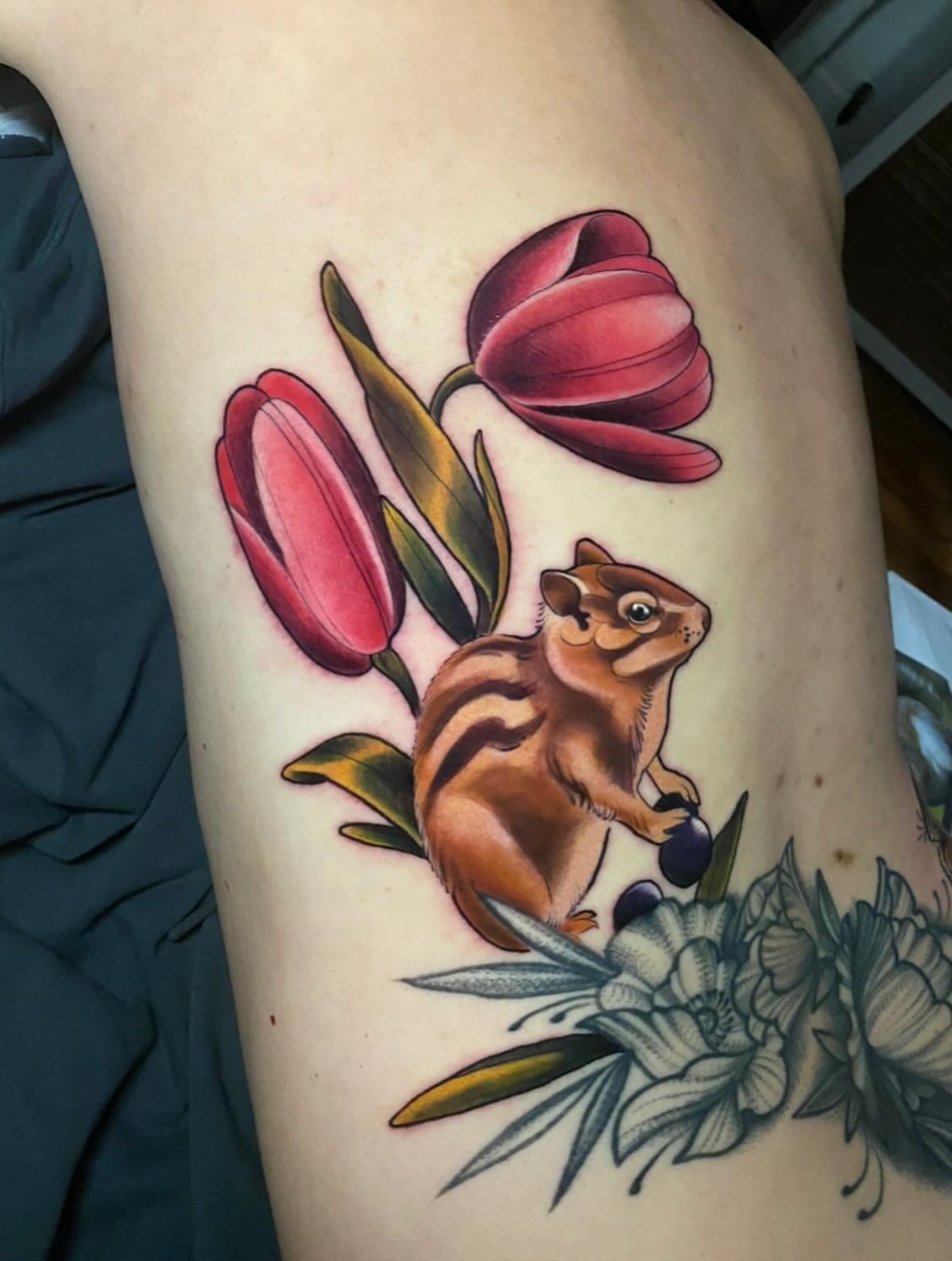 Chipmunk and tulips American traditional tattoo on the thigh by High Vibrations