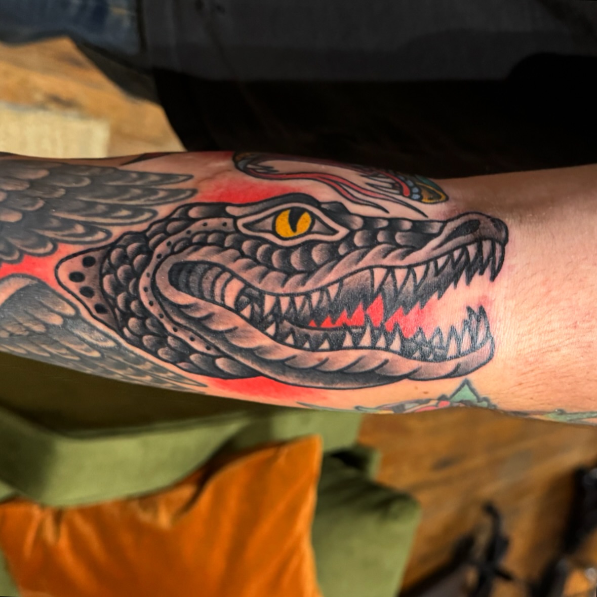 Alligator American traditional tattoo on the forearm by kenneth nash