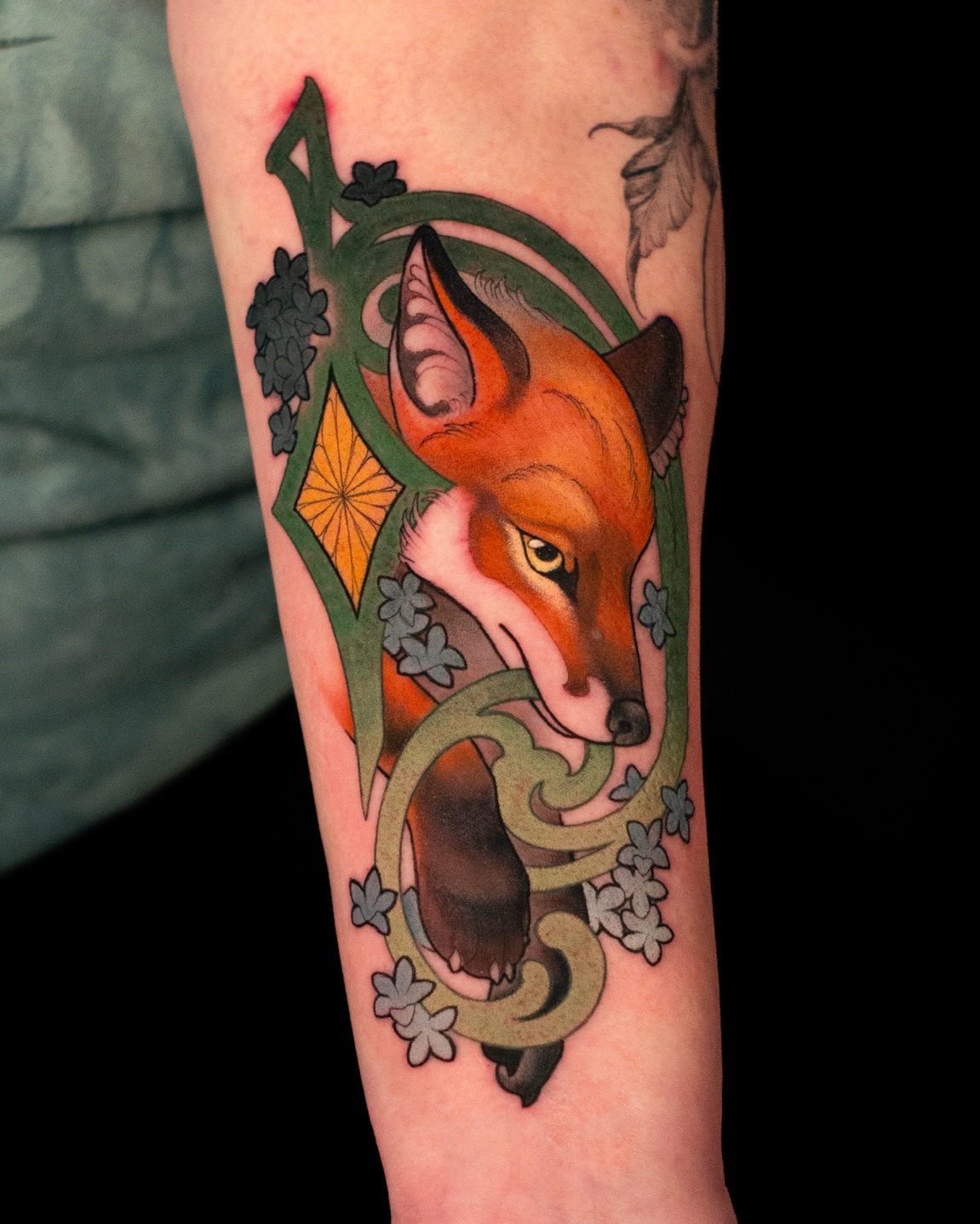 Fox American traditional tattoo on the forearm by Hannah Steele