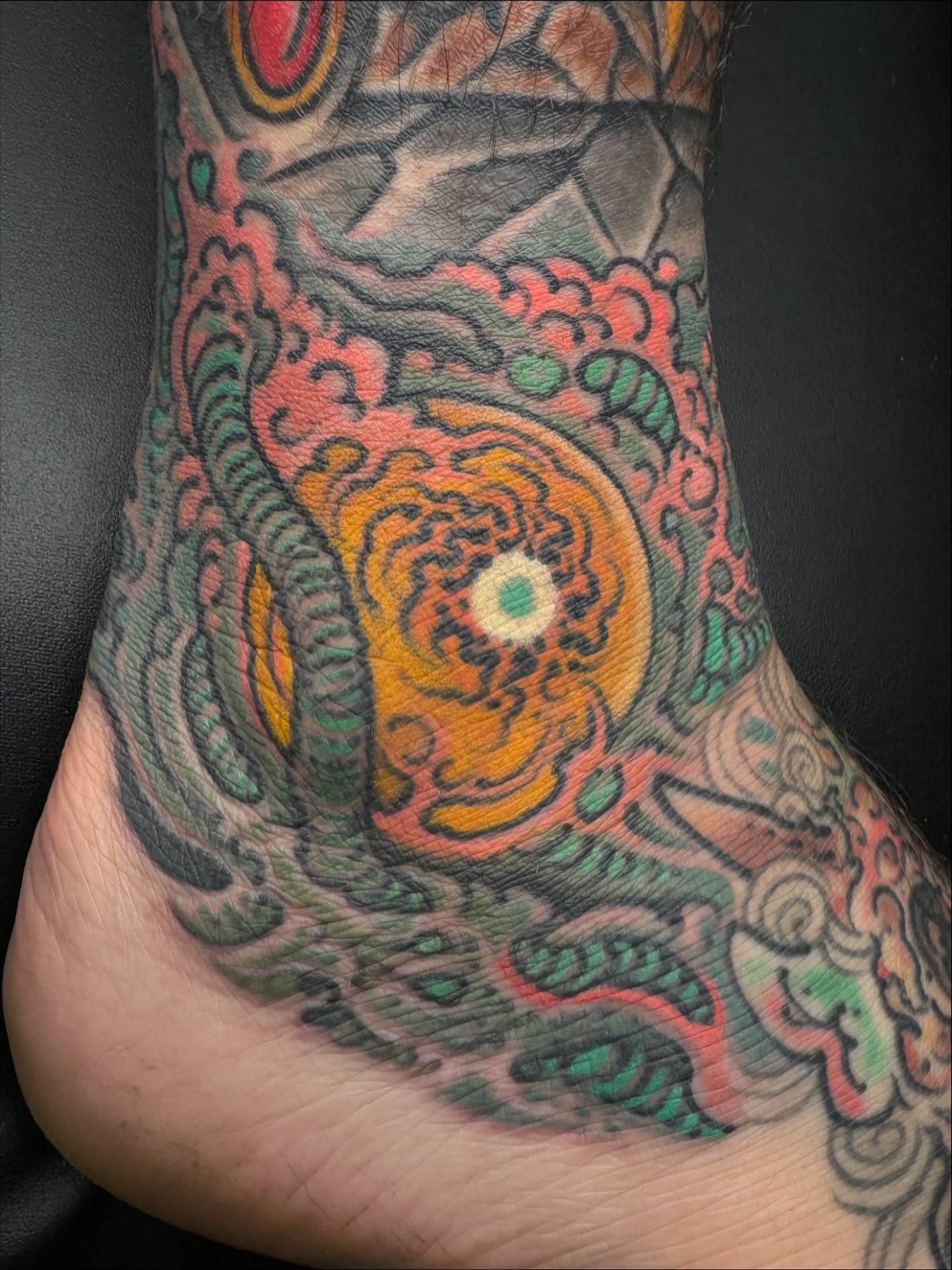 Abstract spiral japanese irezumi tattoo on the foot by J Ranno, Richmond, Virginia