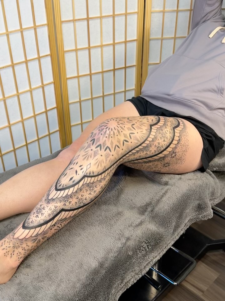 Wing geometric tattoo on the leg by Ian Spencer
