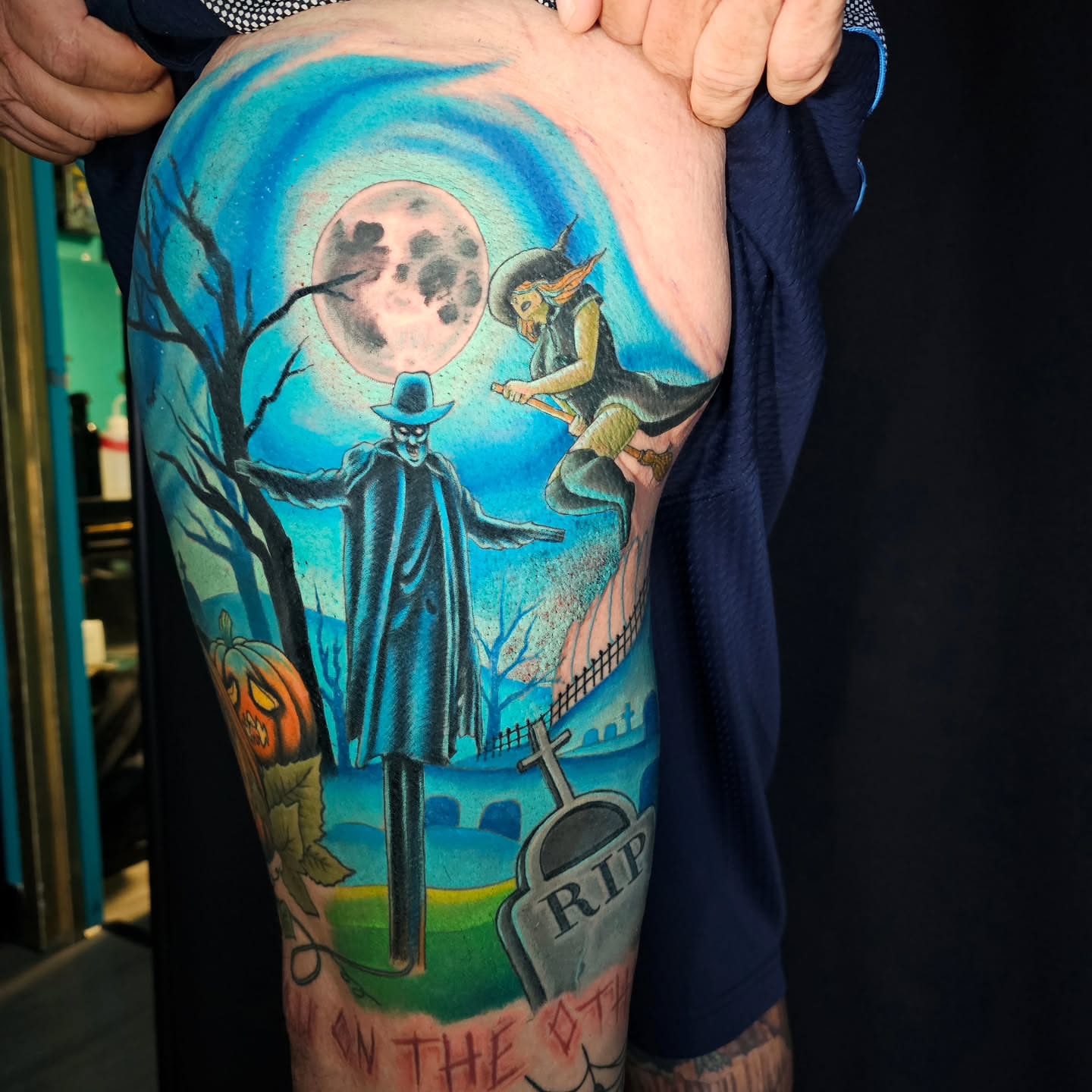 Halloween scene illustrative tattoo on the thigh by Ashwee Hart