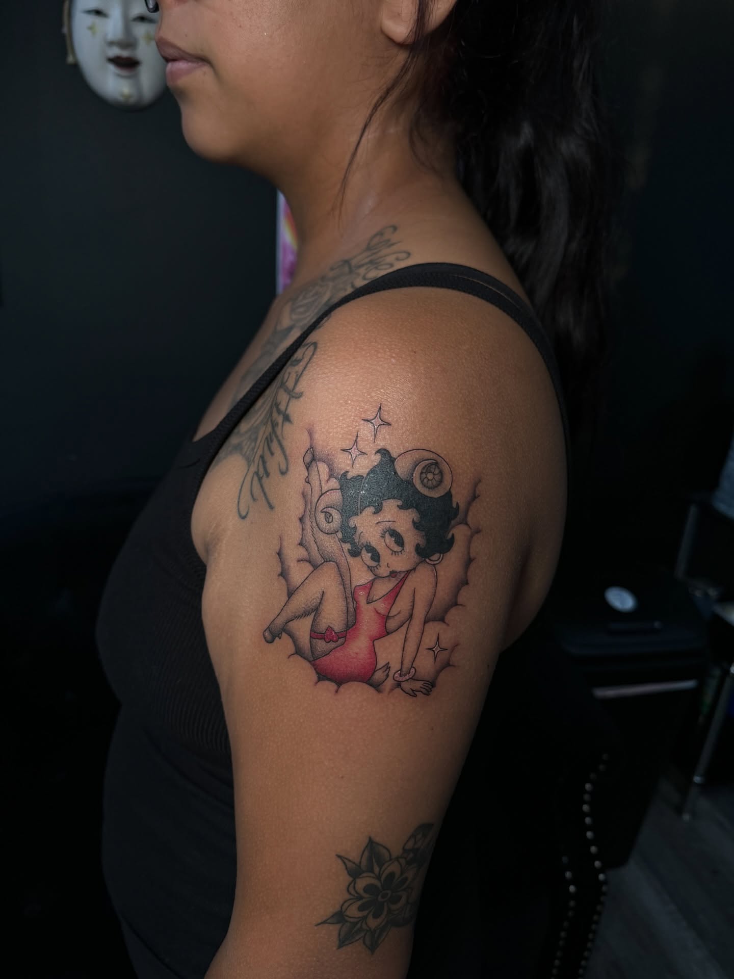 Betty Boop American traditional tattoo on the shoulder by Nathalie Briseno