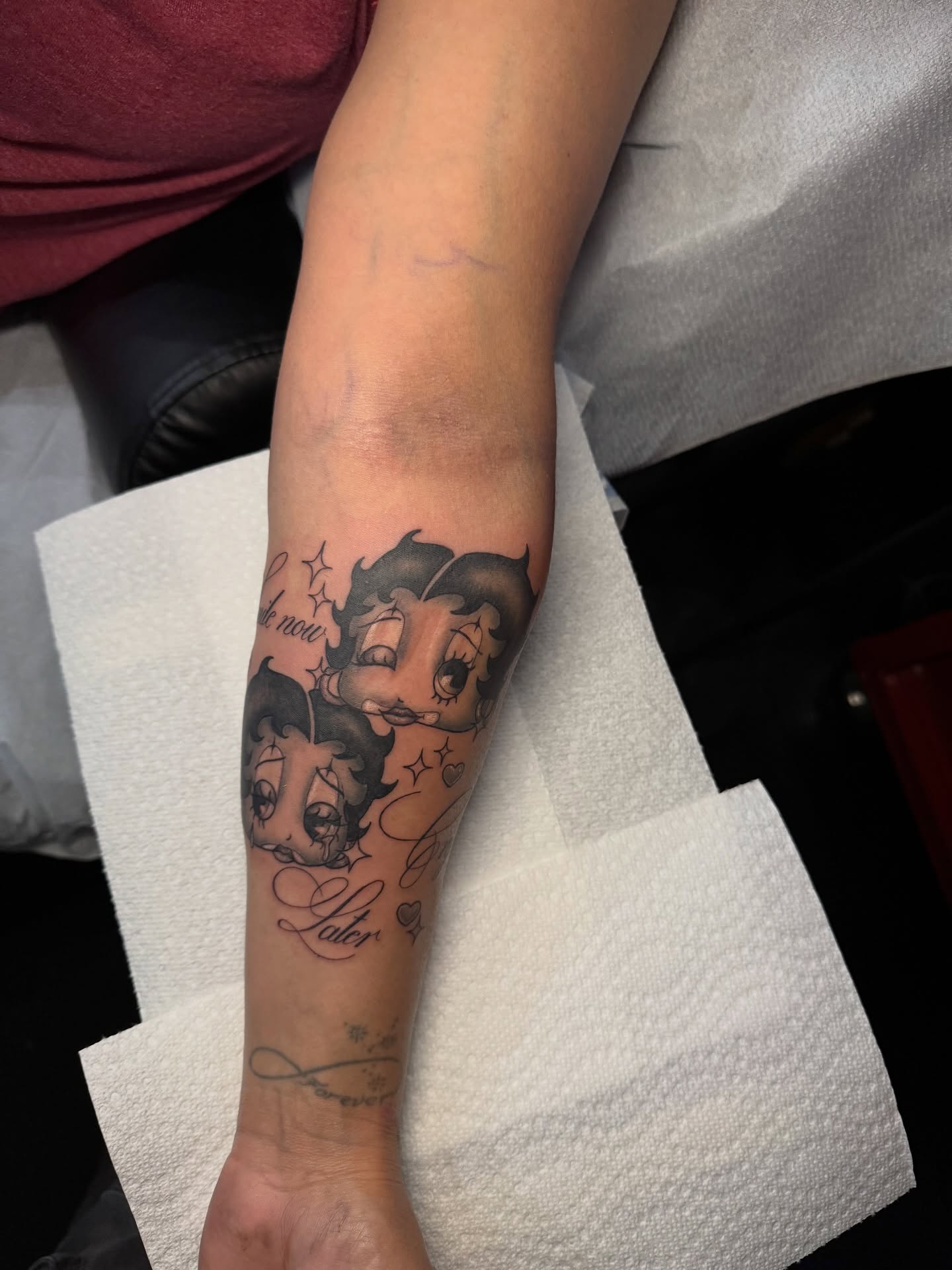 Betty Boop black and grey tattoo on the forearm by Nathalie Briseno