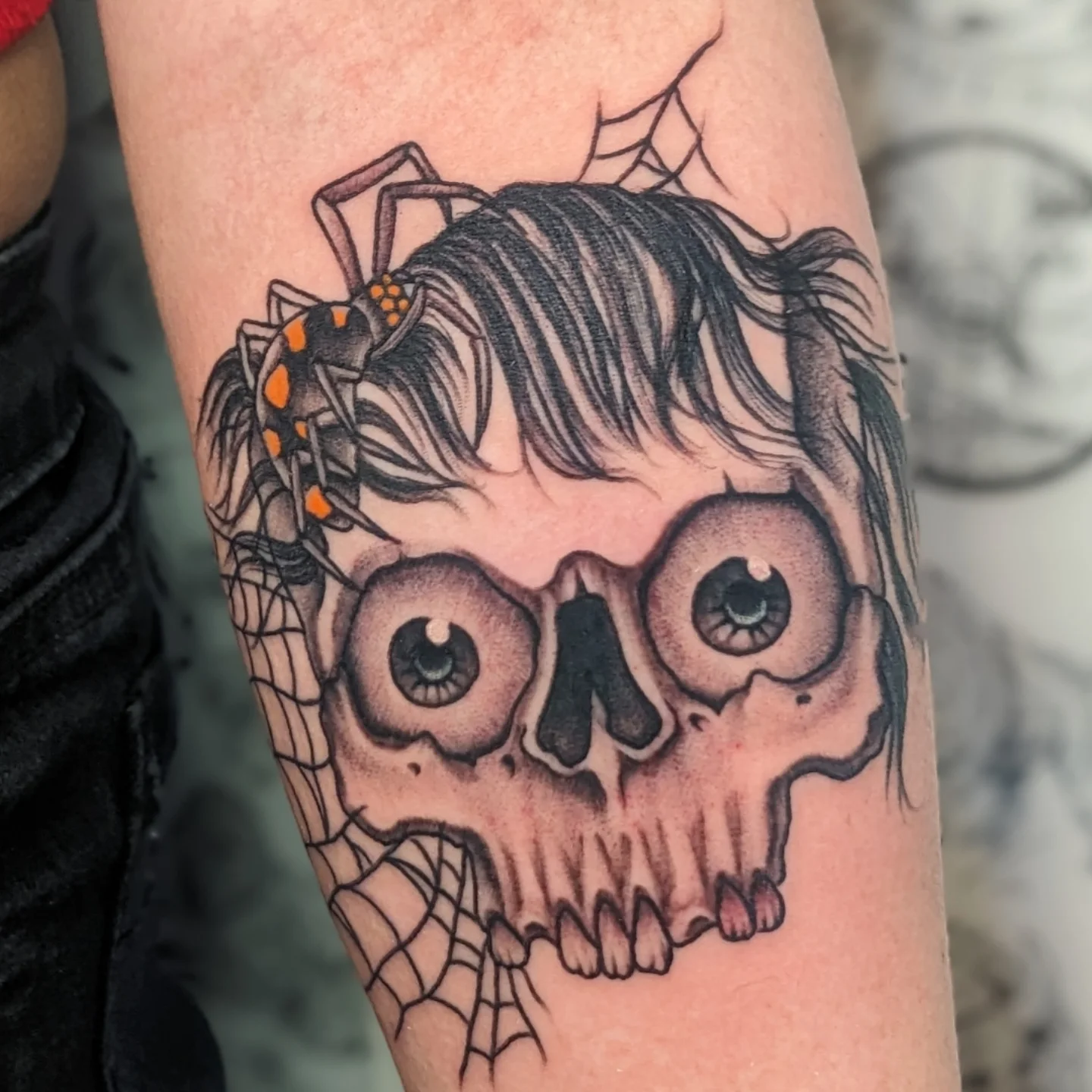 Skull with spider realism tattoo on the forearm by Matt Simmonds