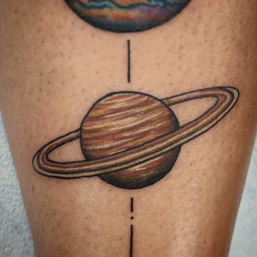 Saturn realism tattoo on the leg by Julie MacDonald
