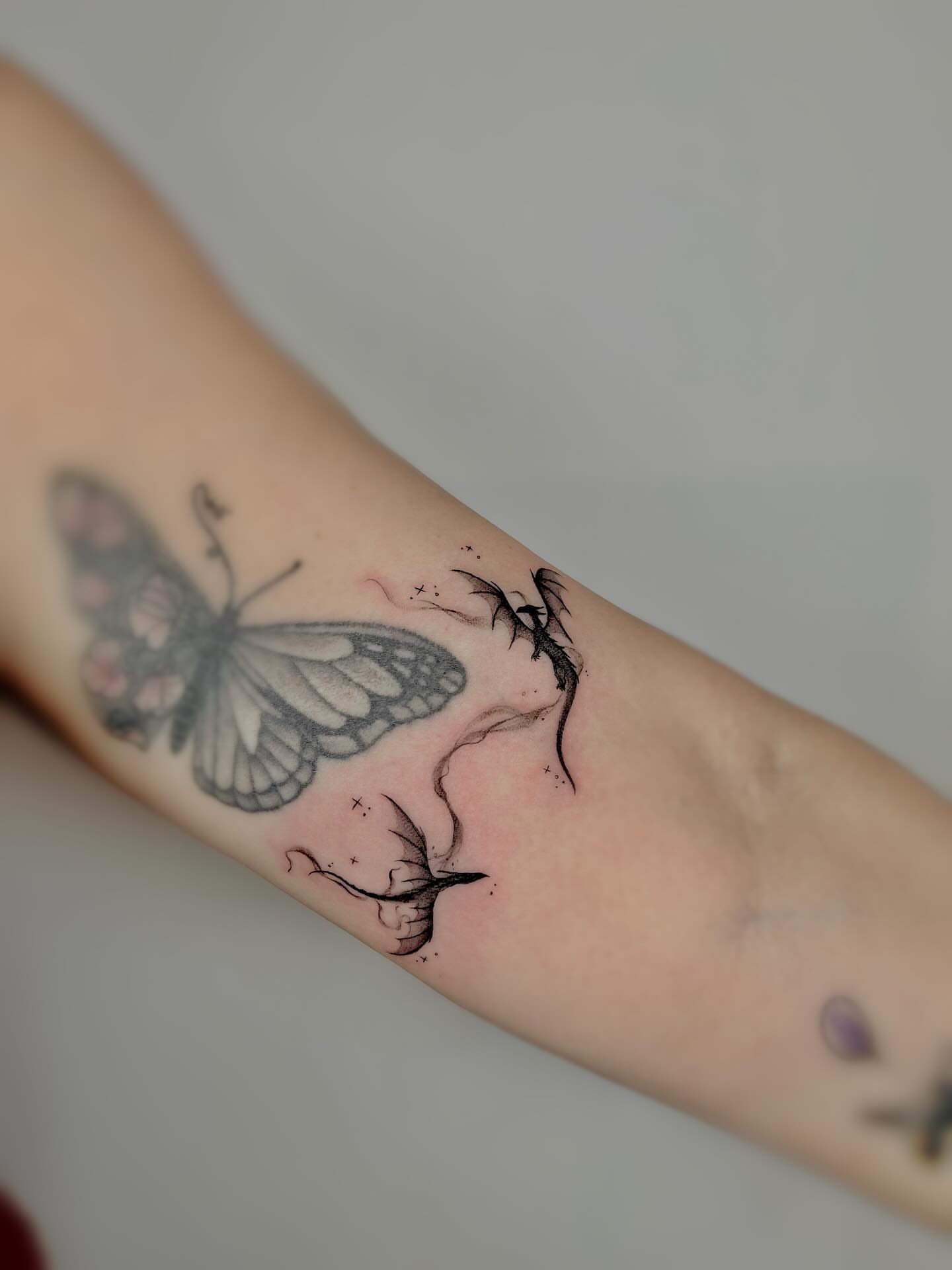 Butterfly black and grey tattoo on the forearm by Kite.Tattoo_Amber