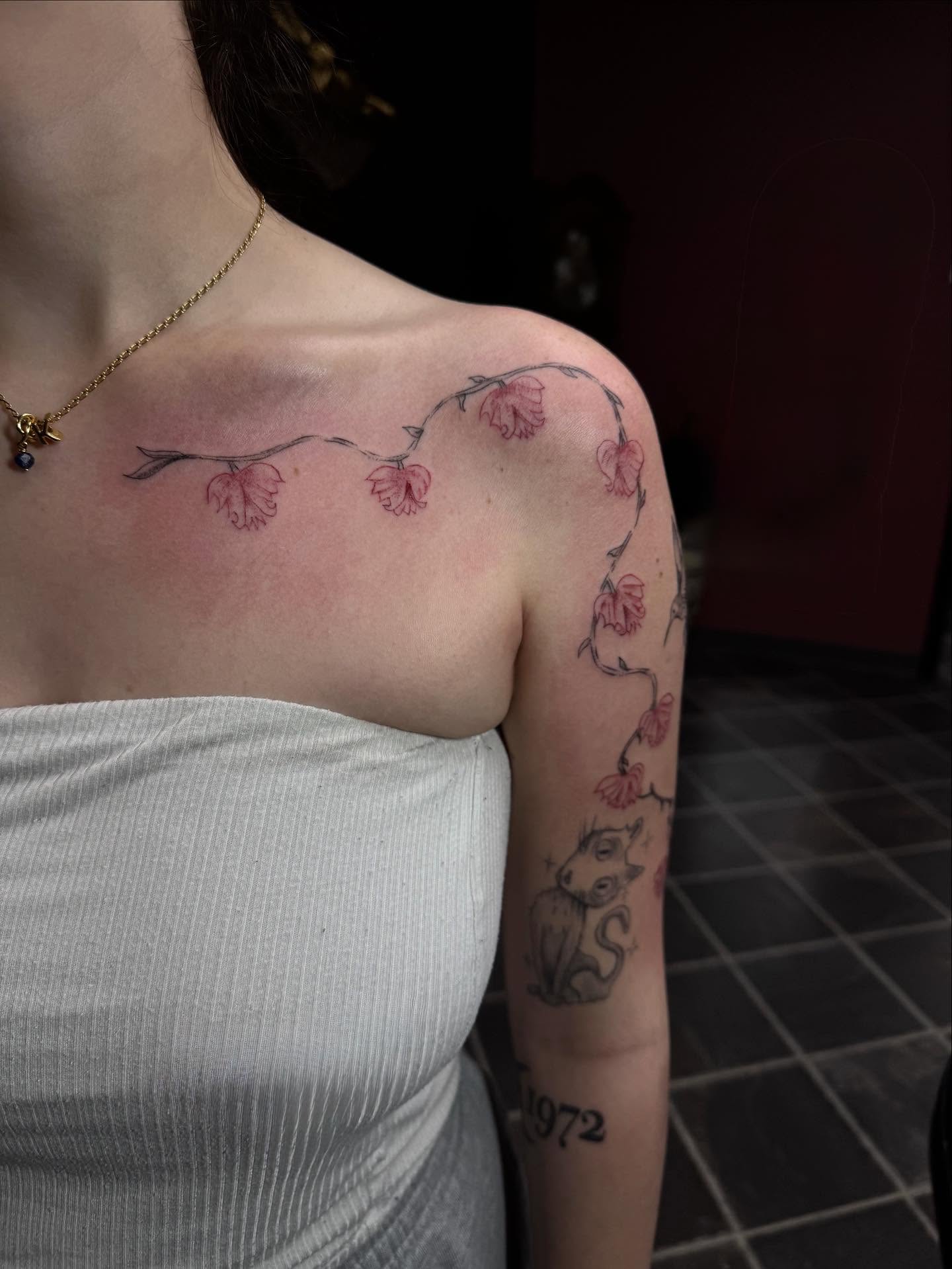 Cherry blossoms dotwork tattoo on the shoulder by olivia reed
