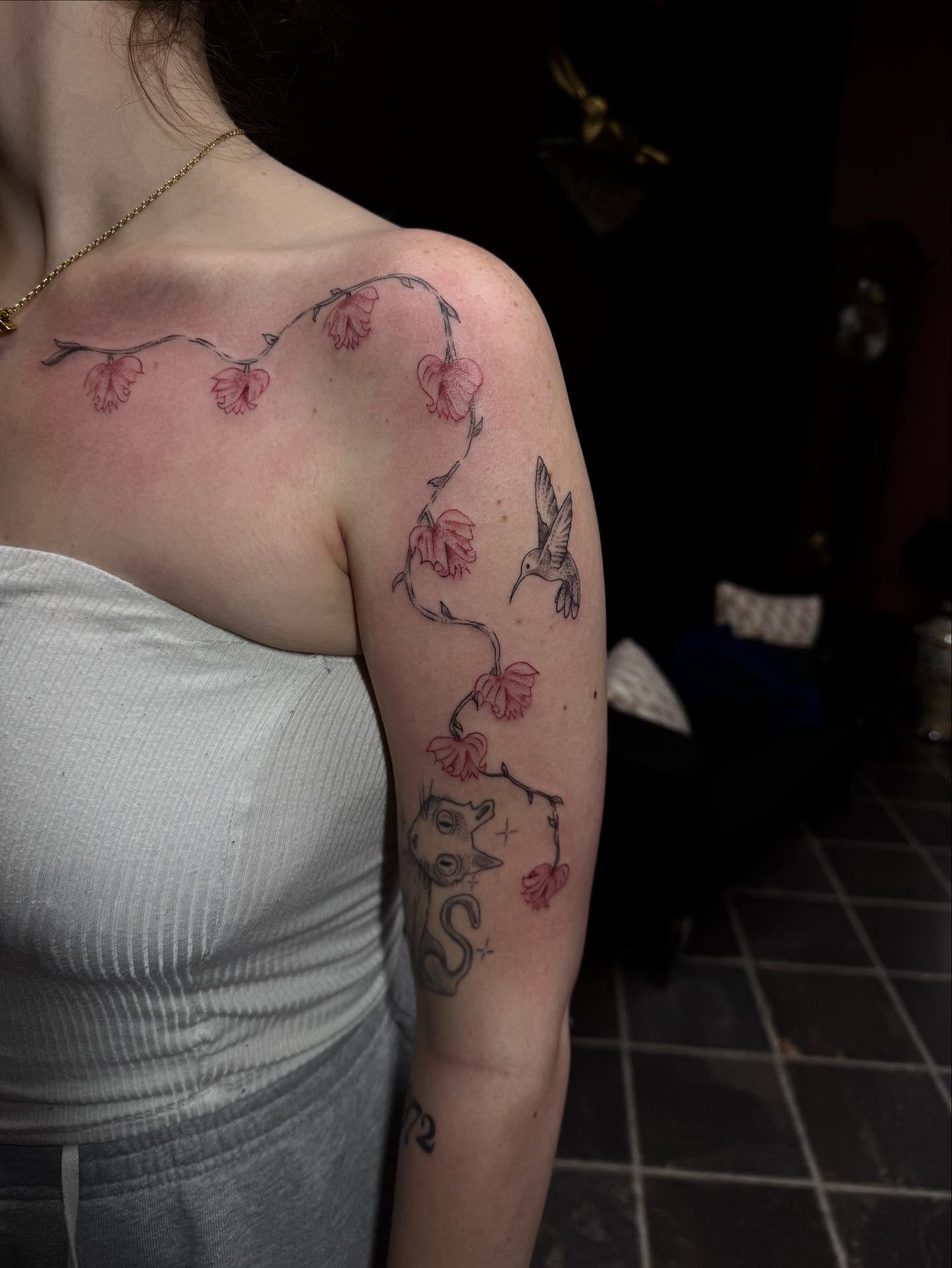 Cherry blossoms and hummingbird dotwork tattoo on the shoulder by olivia reed