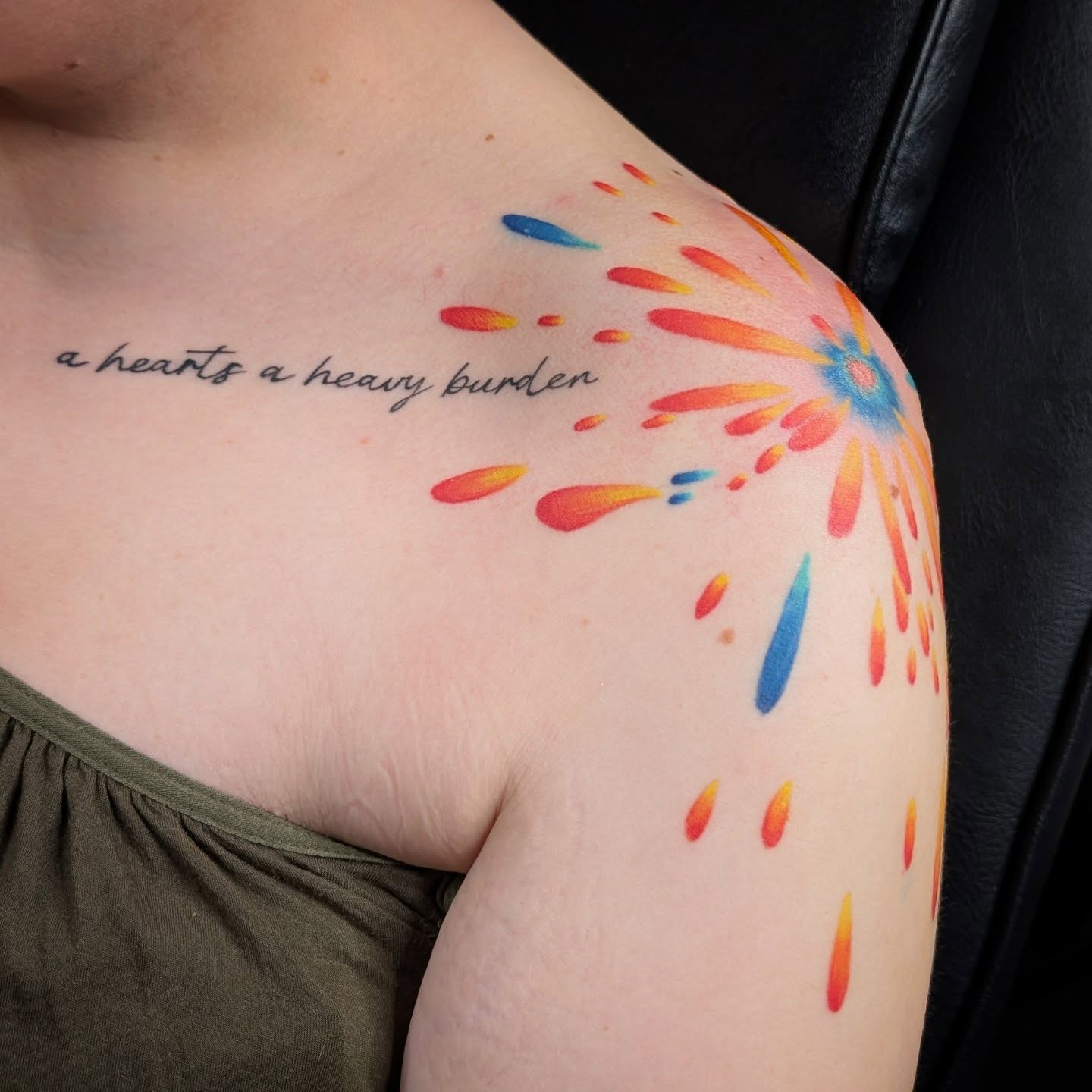 A hearts a heavy burden watercolor tattoo on the shoulder by Michaela May