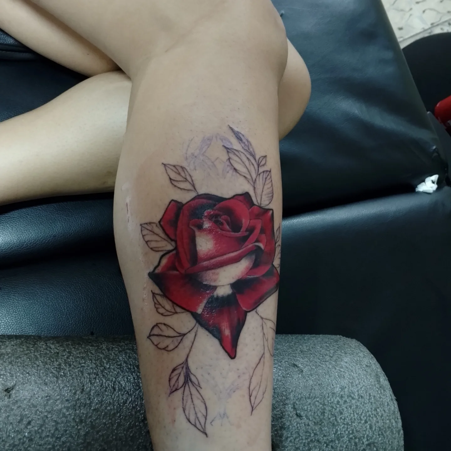 Red rose realism tattoo on the forearm by Alexander Tattooink