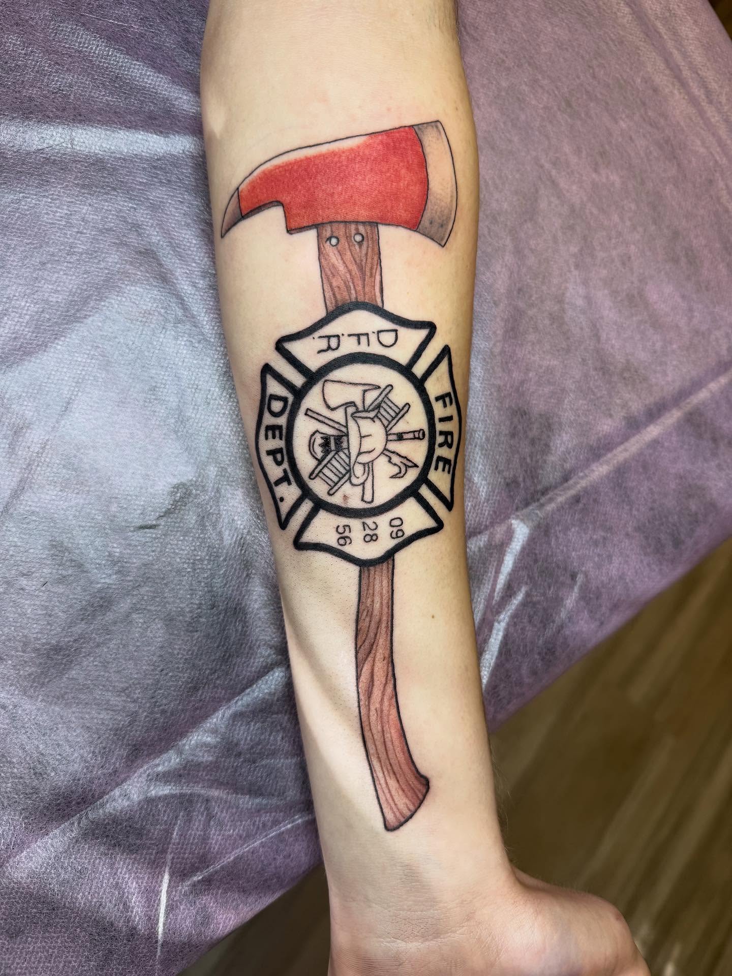 Fire department axe American traditional tattoo on the forearm by Taytum Marsing, Salt Lake City, Utah