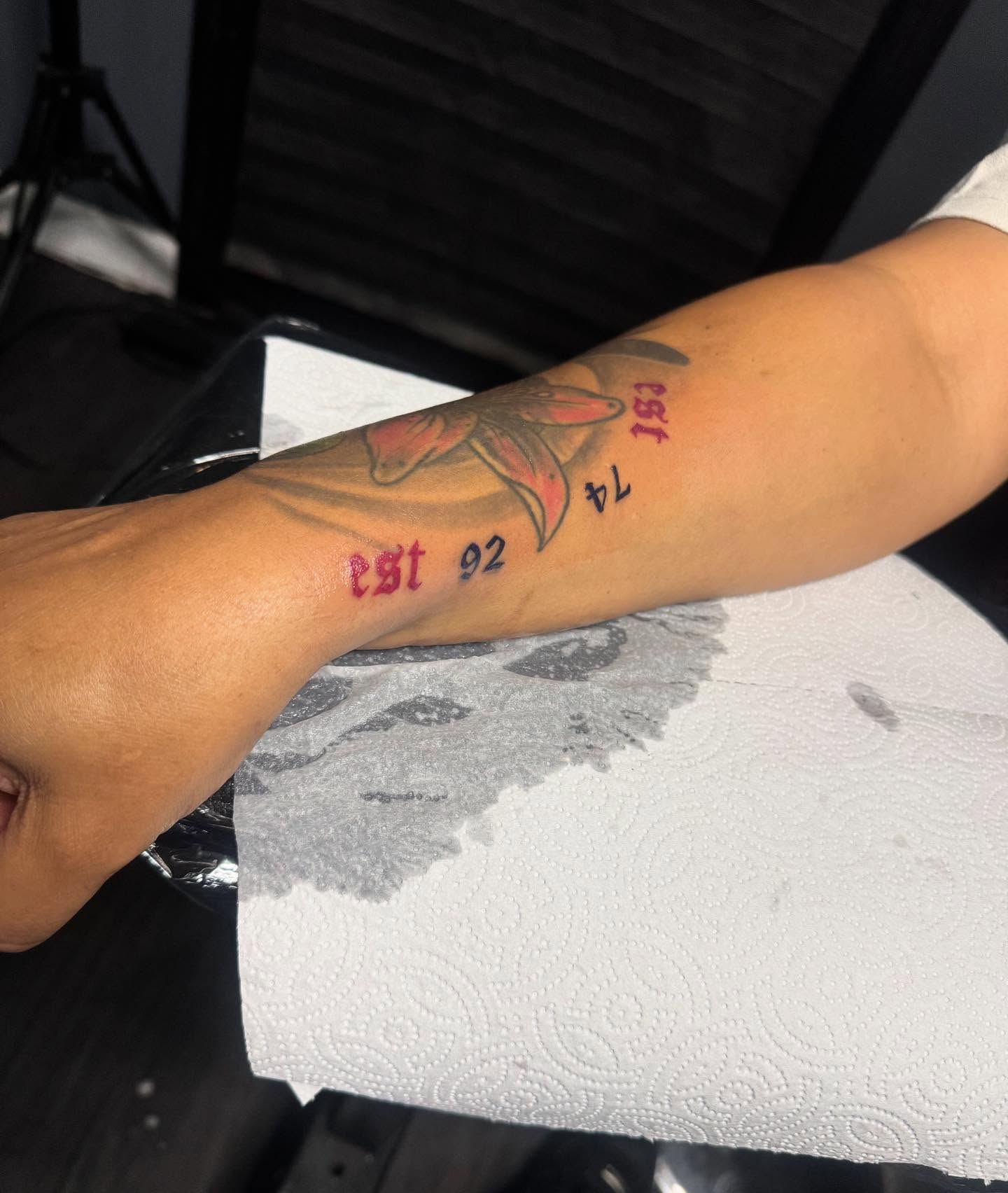 Fish and numbers American traditional tattoo on the forearm by Tattoosbydevon