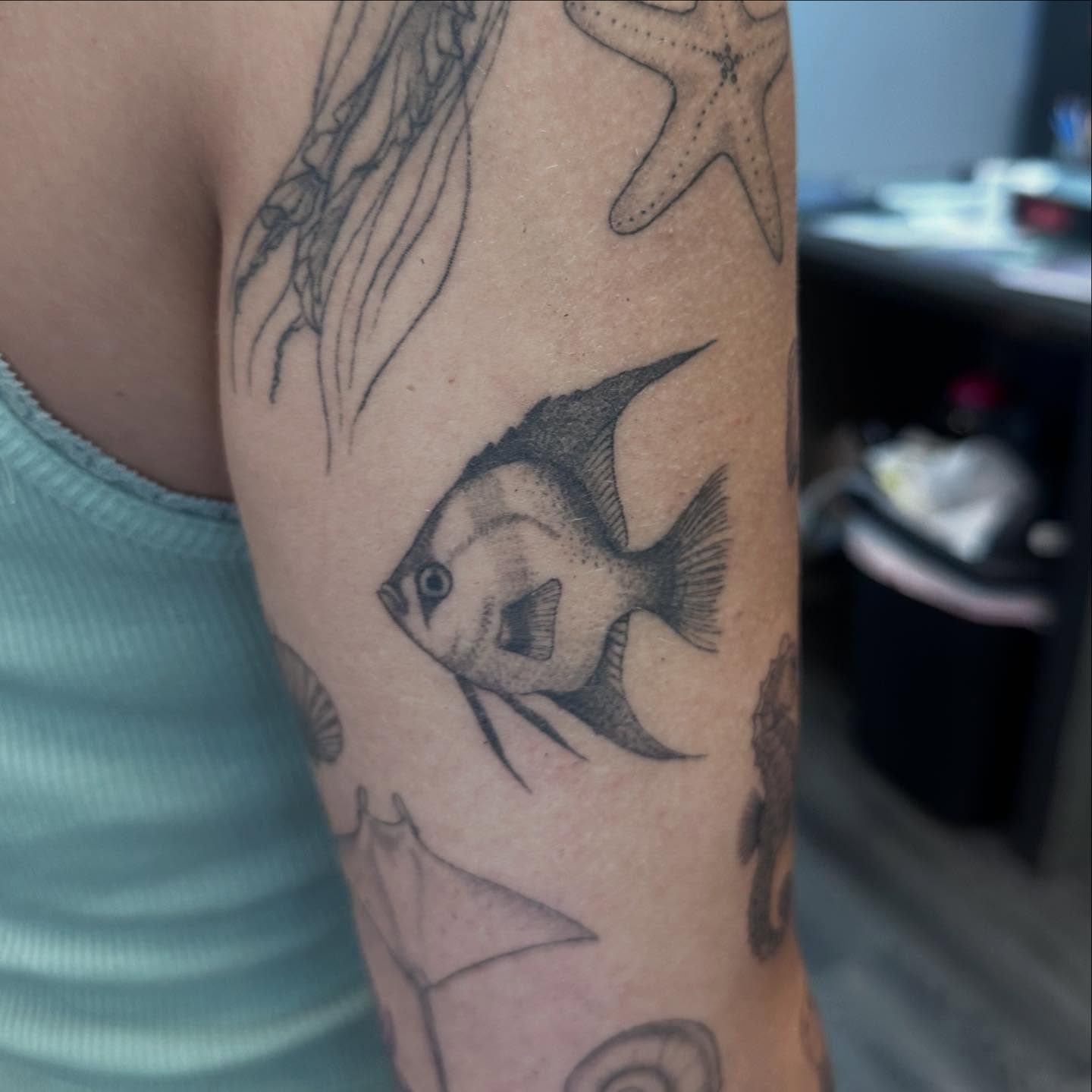 Angelfish black and grey tattoo on the forearm by Bell